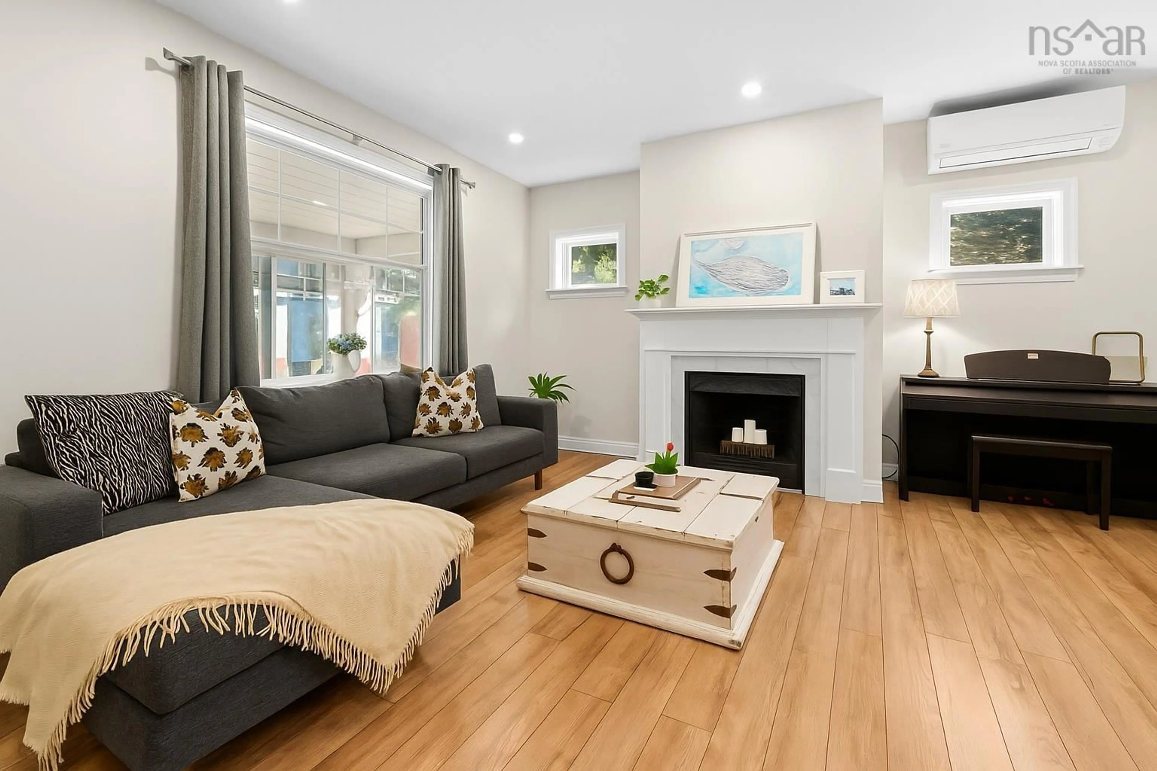 Living room with furniture, wood/laminate floor for 6354 Pepperell St, Halifax Nova Scotia B3H 2P4