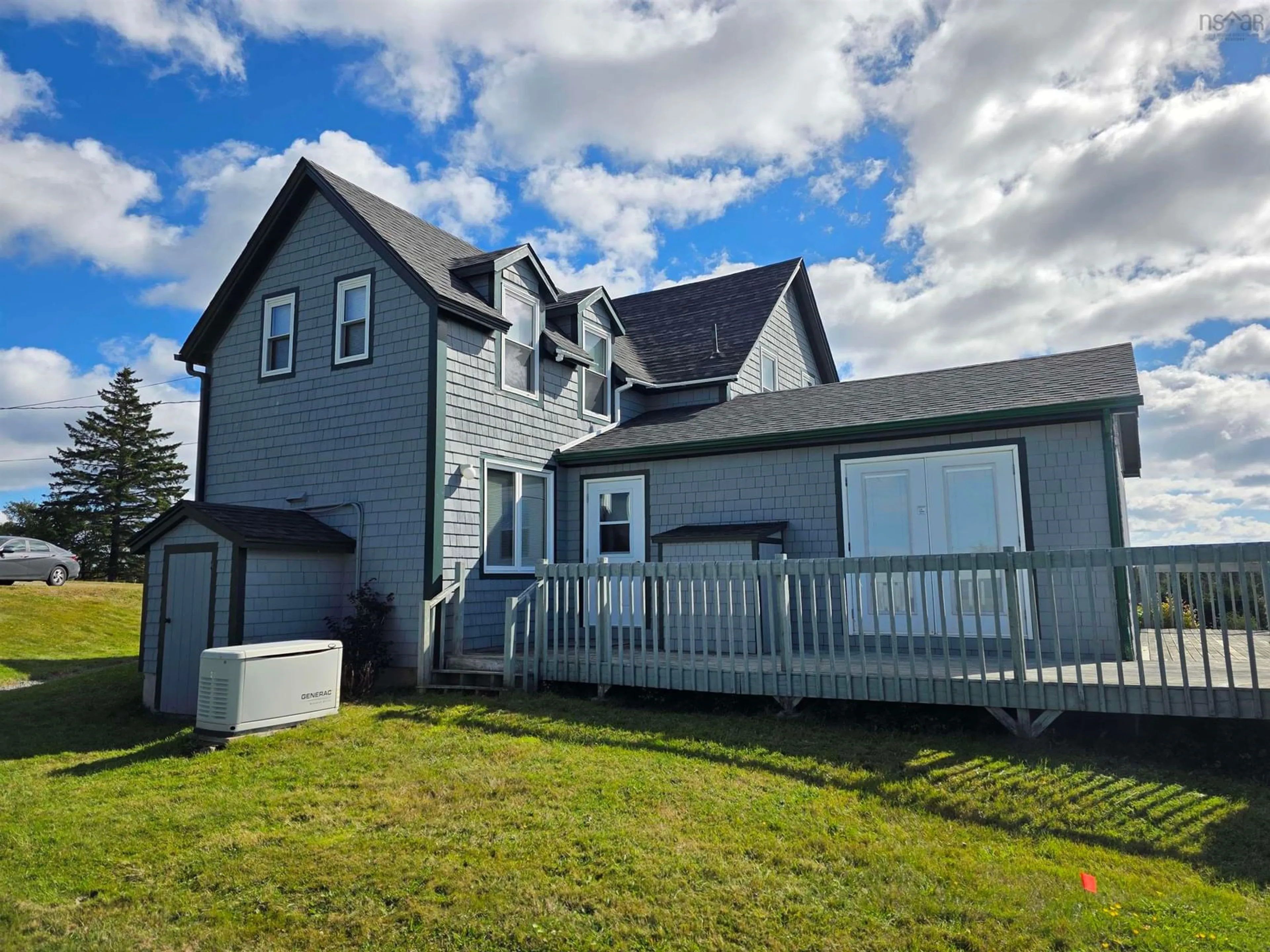 A pic from outside/outdoor area/front of a property/back of a property/a pic from drone, unknown for 420 Church Point Rd, River Bourgeois Nova Scotia B0E 2X0
