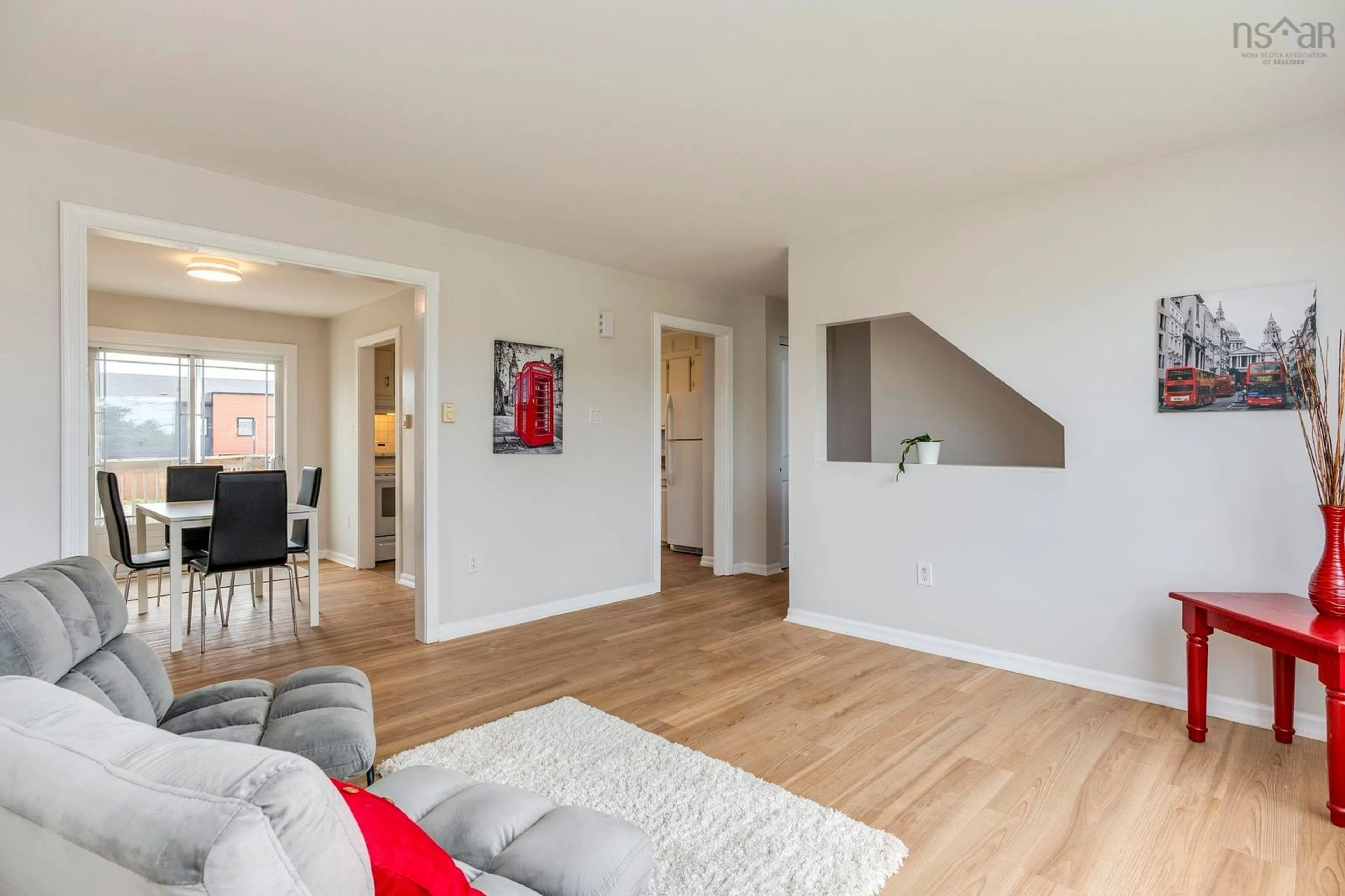 Living room with furniture, wood/laminate floor for 1760 Caldwell Rd, Eastern Passage Nova Scotia B3G 1J4