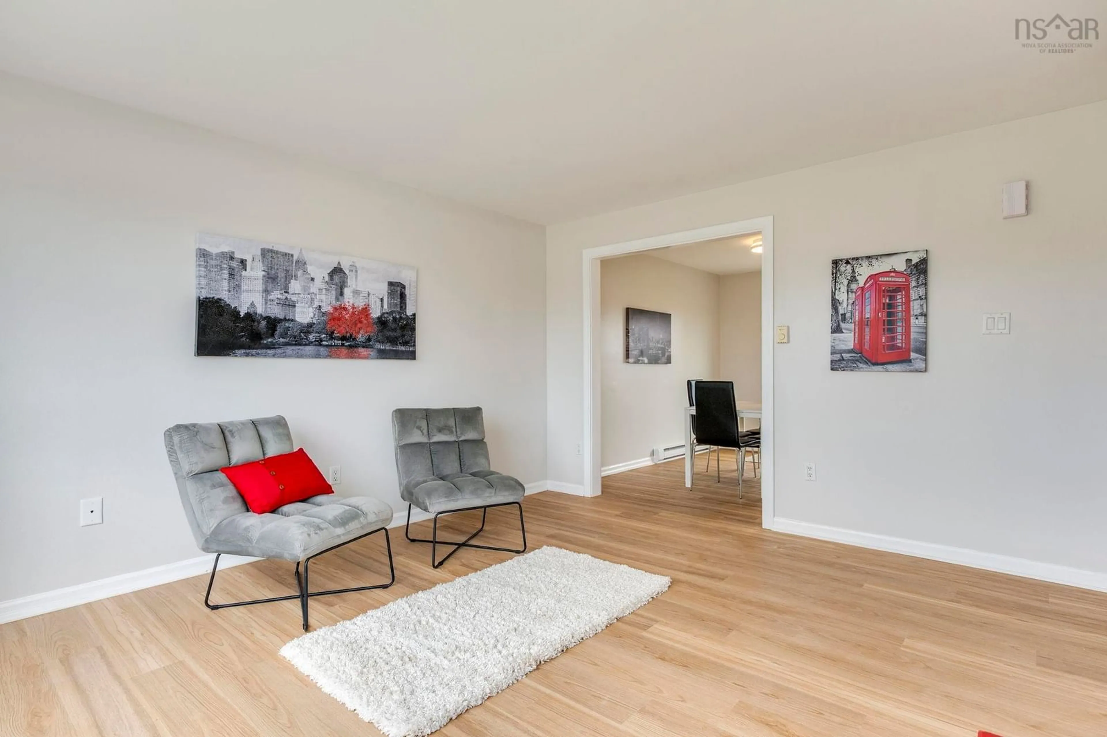 Living room with furniture, wood/laminate floor for 1760 Caldwell Rd, Eastern Passage Nova Scotia B3G 1J4