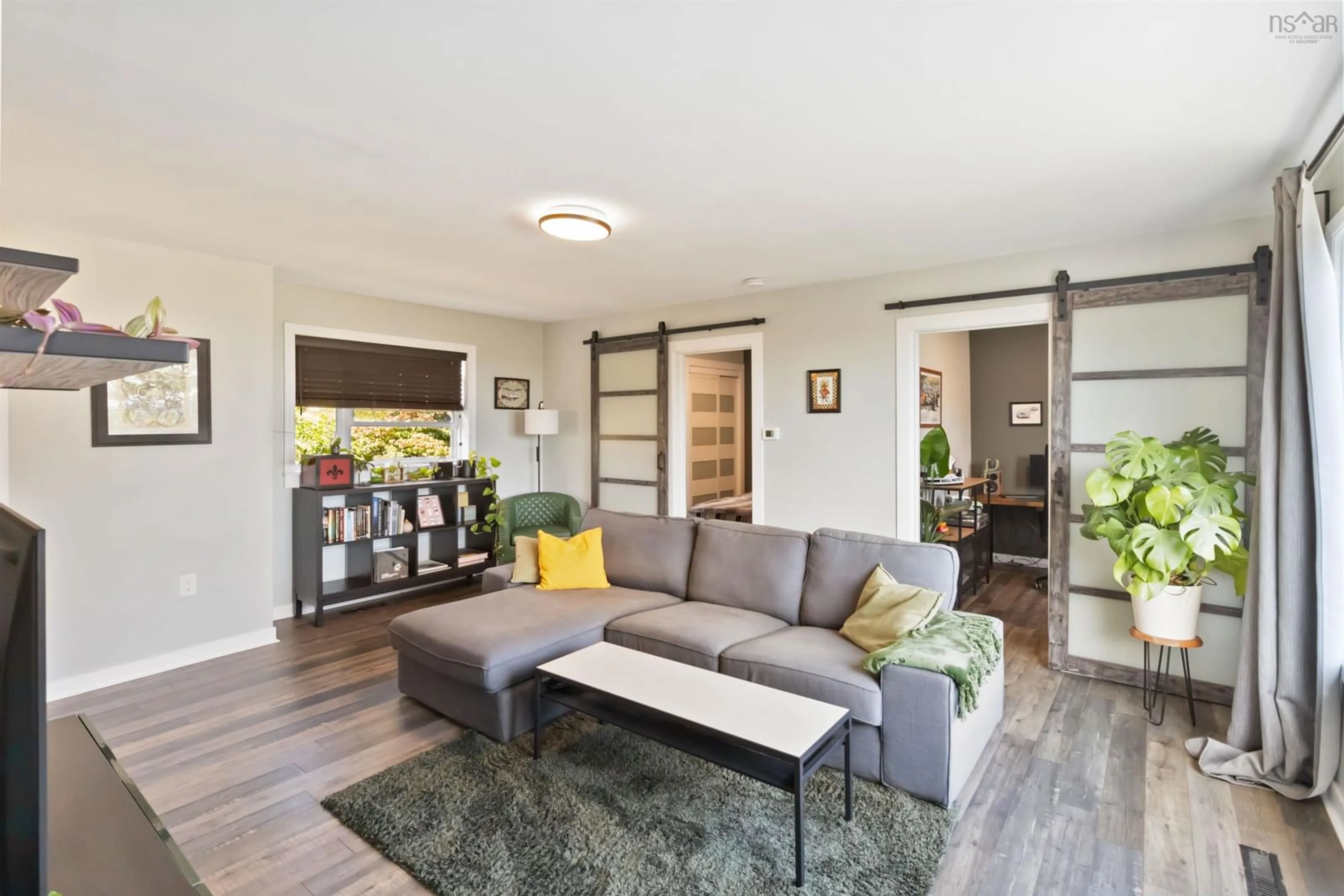 Living room with furniture, wood/laminate floor for 675 Ketch Harbour Rd, Portuguese Cove Nova Scotia B3V 1K2