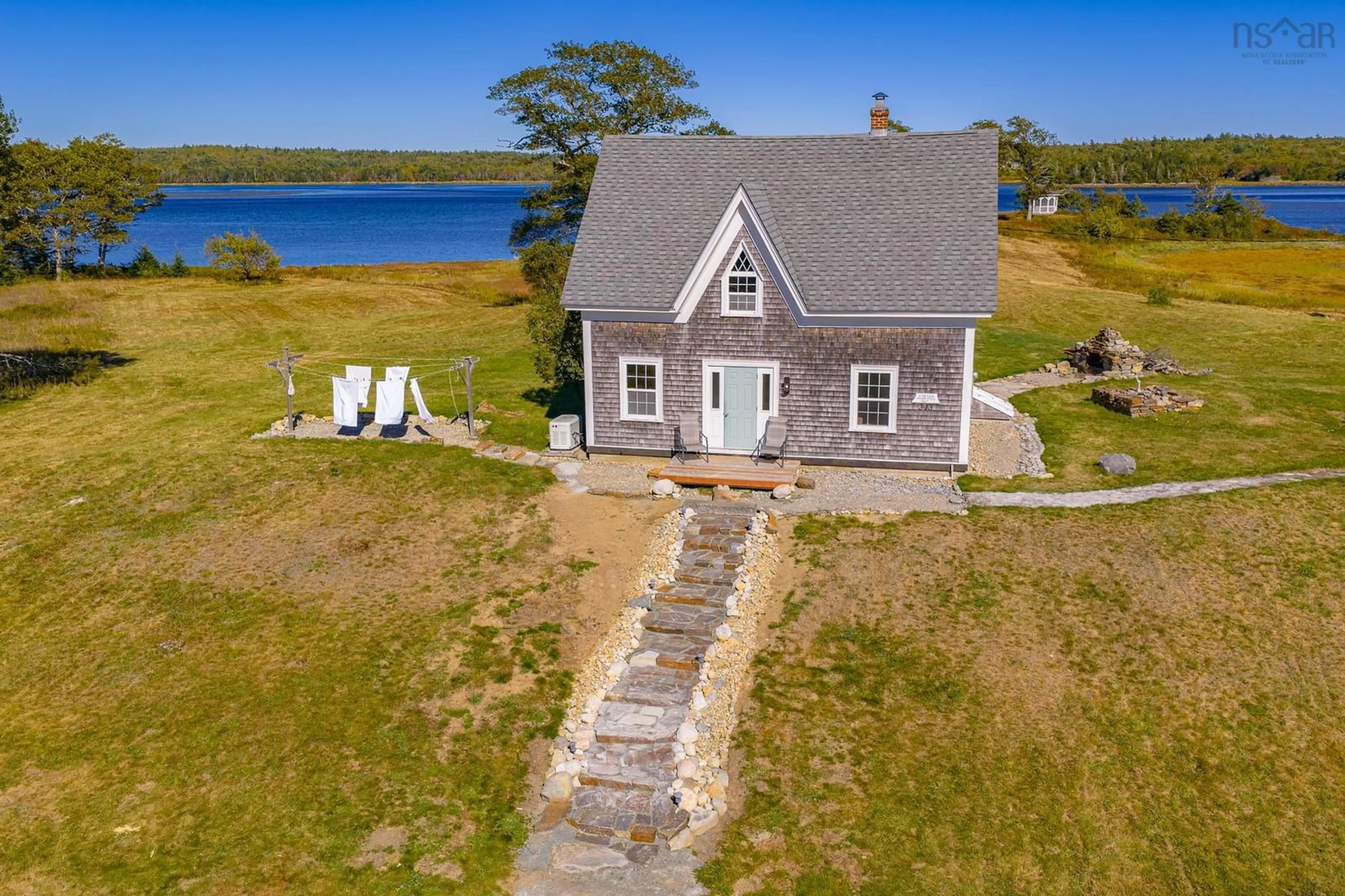 A pic from outside/outdoor area/front of a property/back of a property/a pic from drone, water/lake/river/ocean view for 343 West Sable Rd, Sable River Nova Scotia B0T 1V0