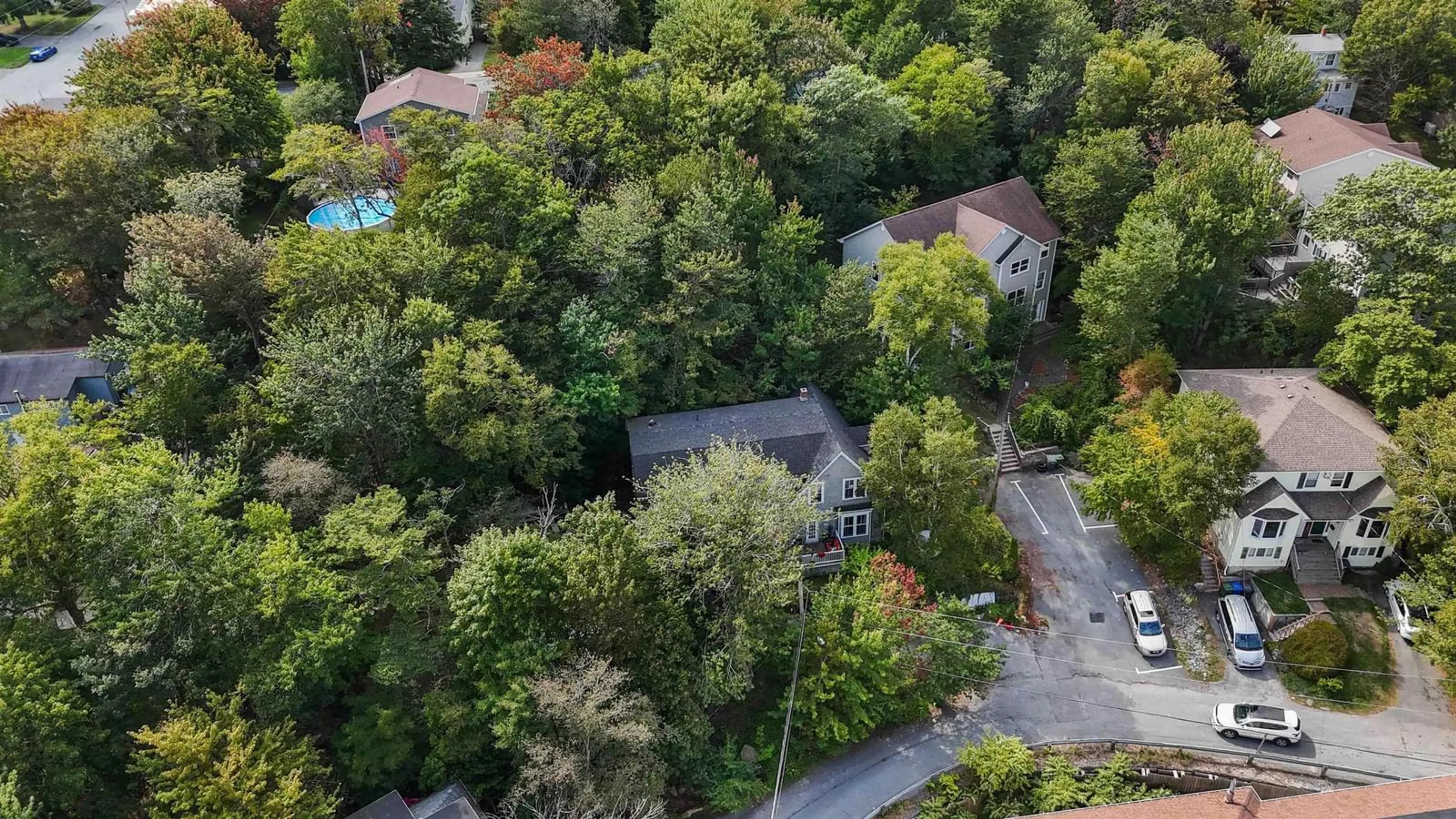 A pic from outside/outdoor area/front of a property/back of a property/a pic from drone, forest/trees view for 24 Northumberland Lane, Halifax Nova Scotia B3M 1R7