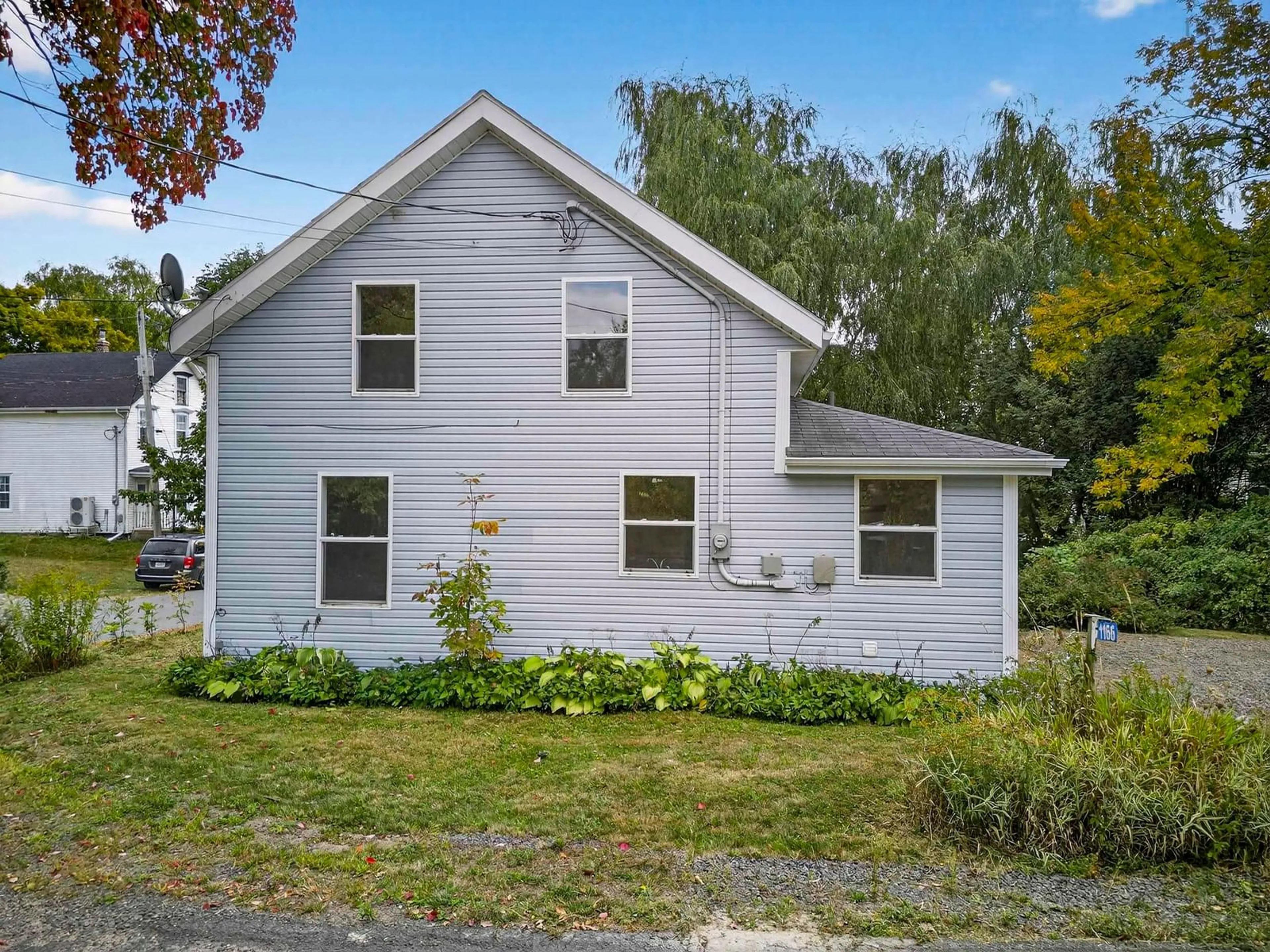 Home with vinyl exterior material, street for 1166 Bigelow Street, Canning Nova Scotia B0P 1H0