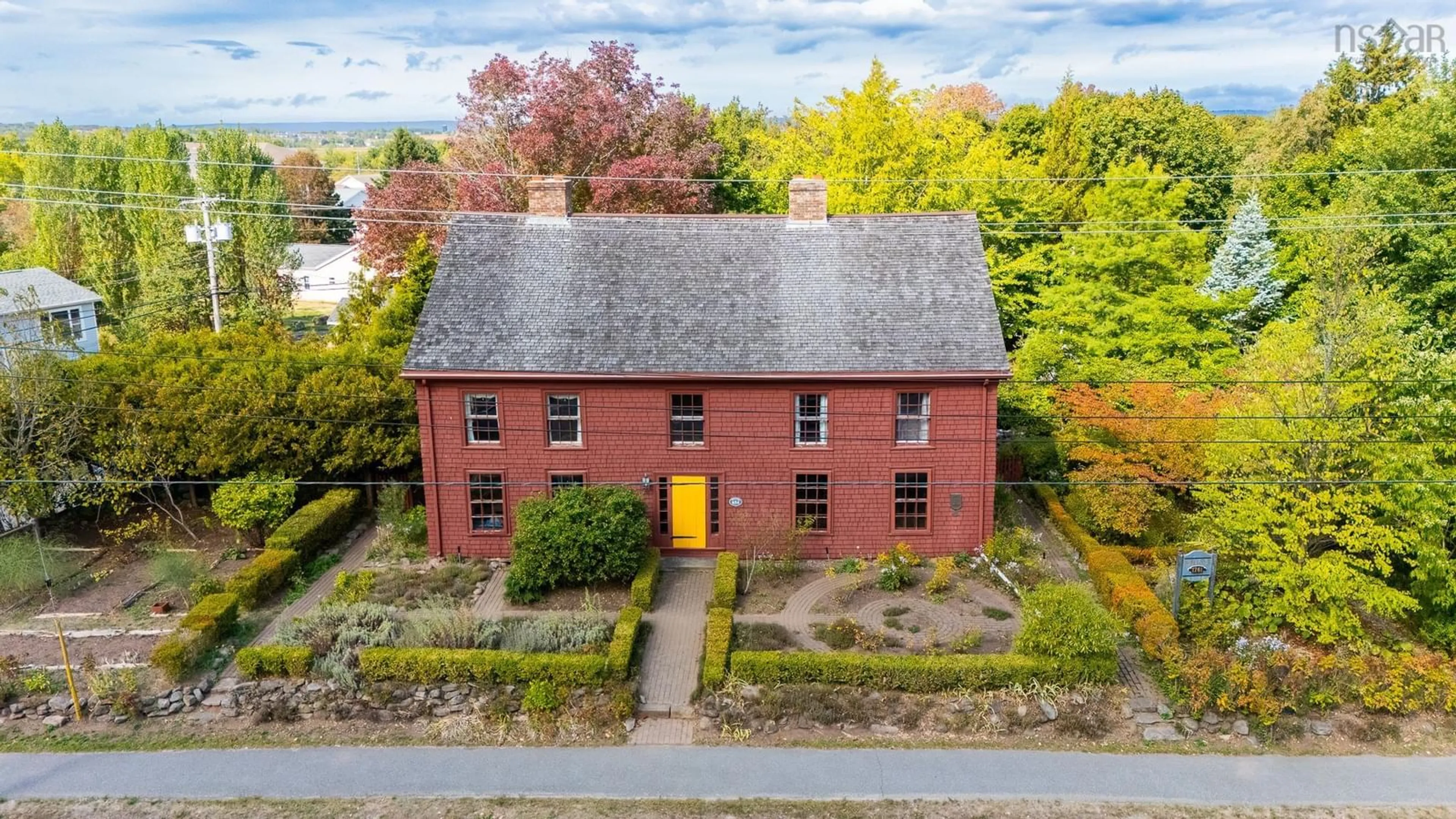 A pic from outside/outdoor area/front of a property/back of a property/a pic from drone, building for 654 Main St, Wolfville Nova Scotia B4P 1E8