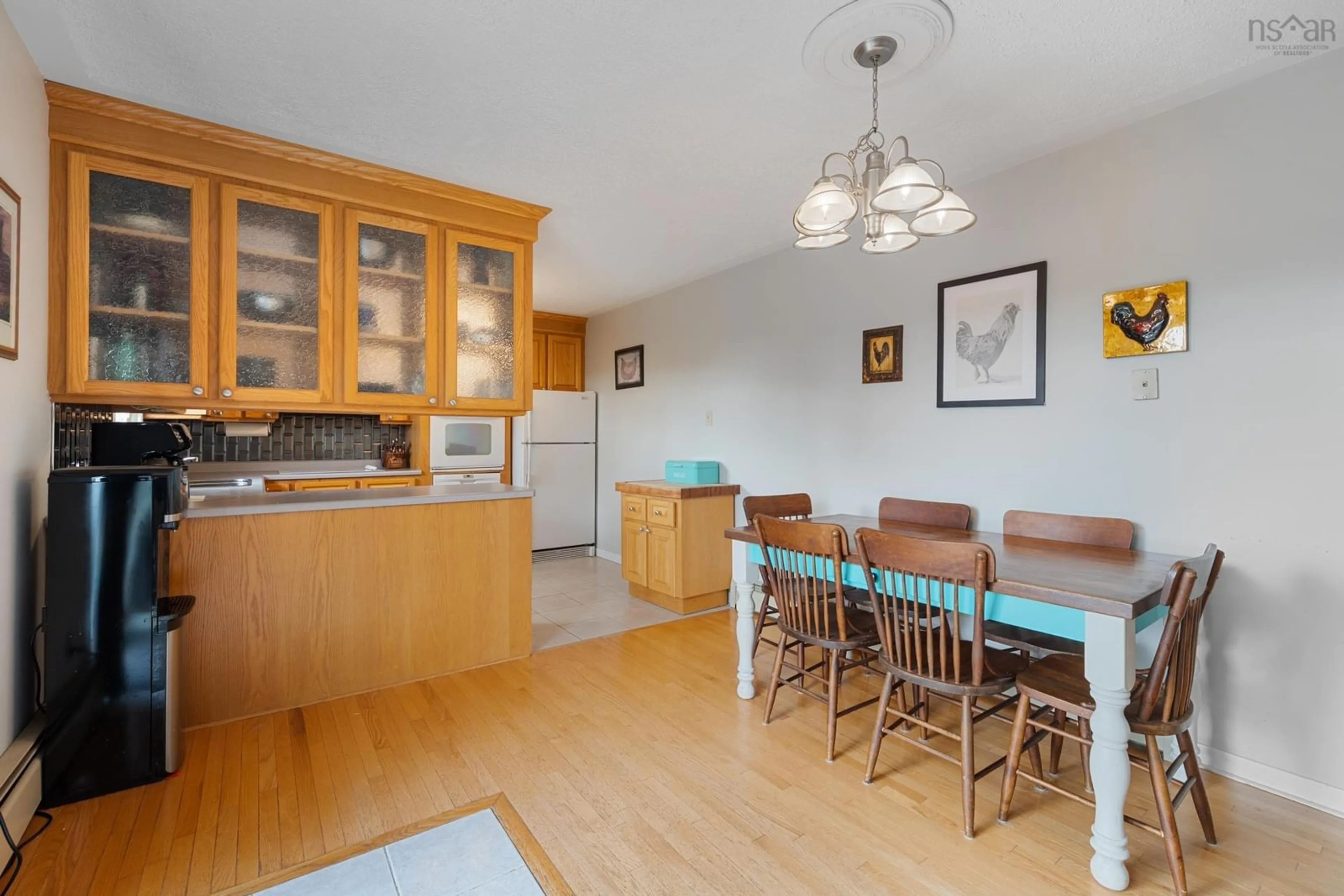 Open concept kitchen, wood/laminate floor for 7068 Highway 1, St. Alphonse Nova Scotia B0W 2J0