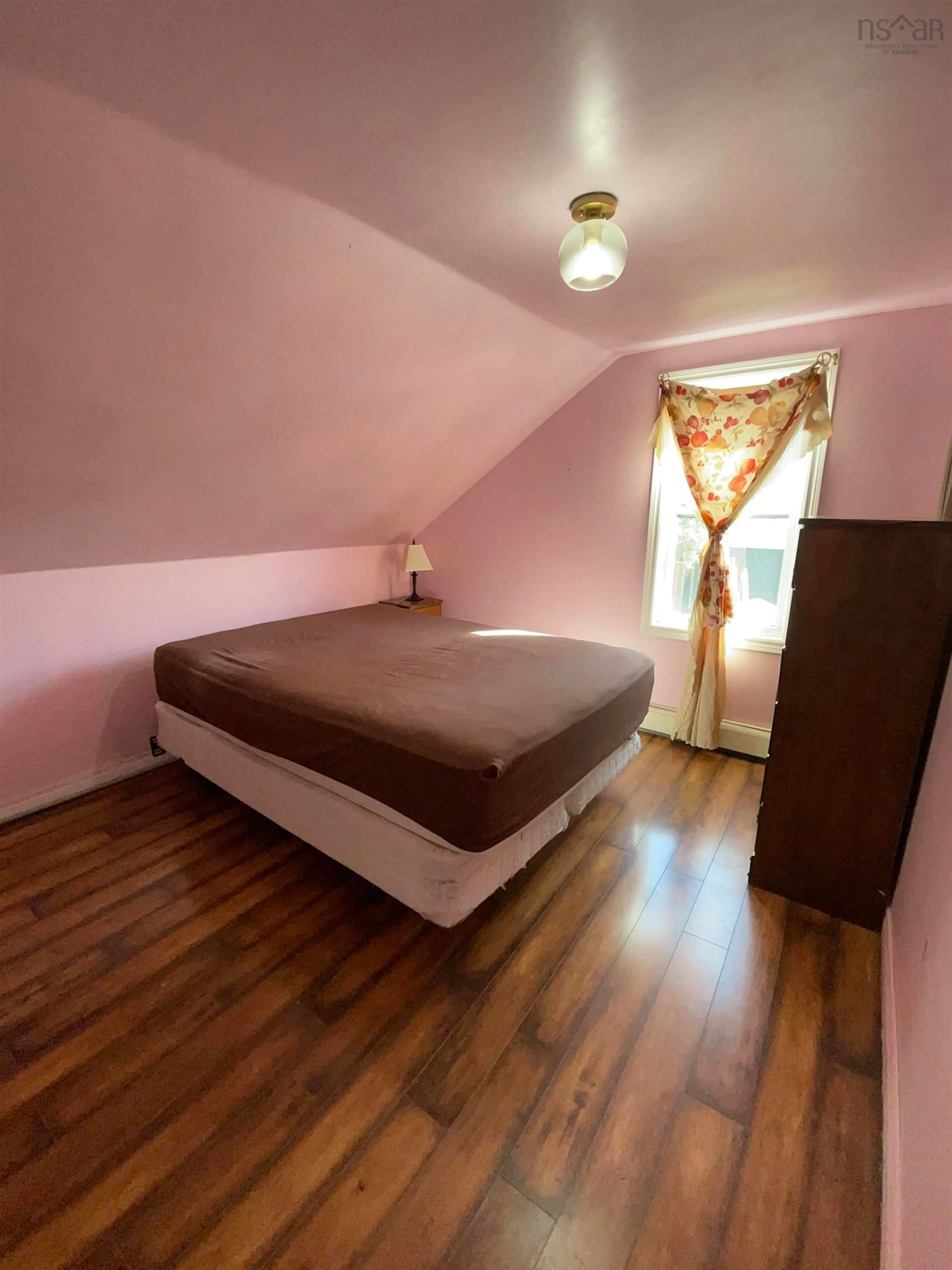 Bedroom with bed, wood/laminate floor for 88 Catherine St, Glace Bay Nova Scotia B1A 2K3