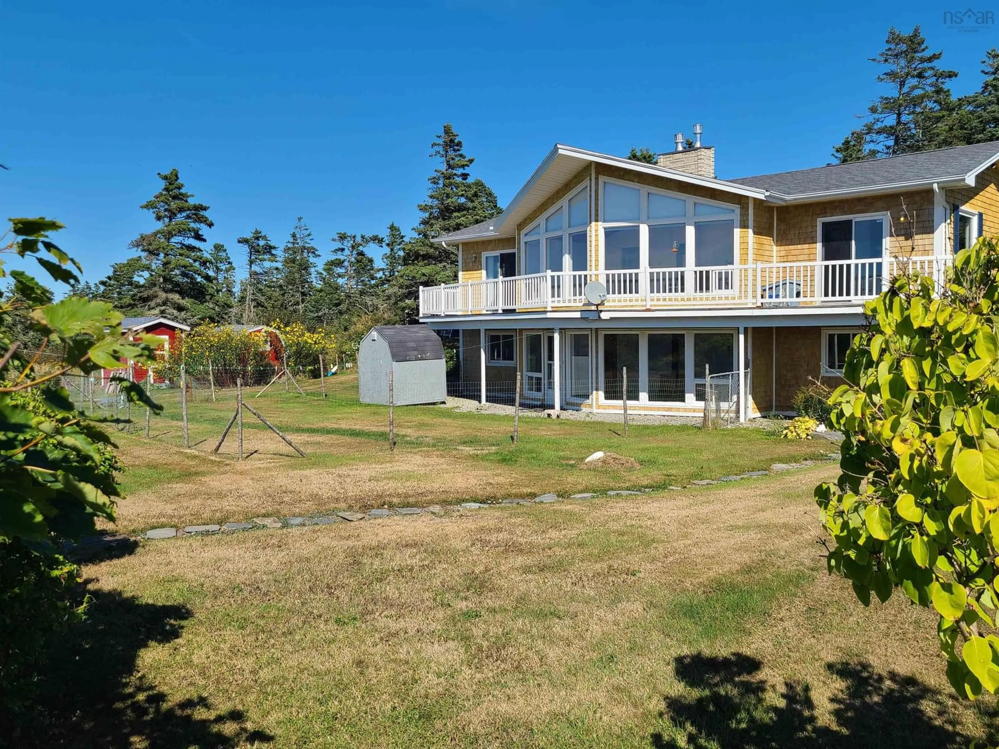 A pic from outside/outdoor area/front of a property/back of a property/a pic from drone, water/lake/river/ocean view for 2815 Main Shore Road Rd, Port Maitland Nova Scotia B5A 5C4