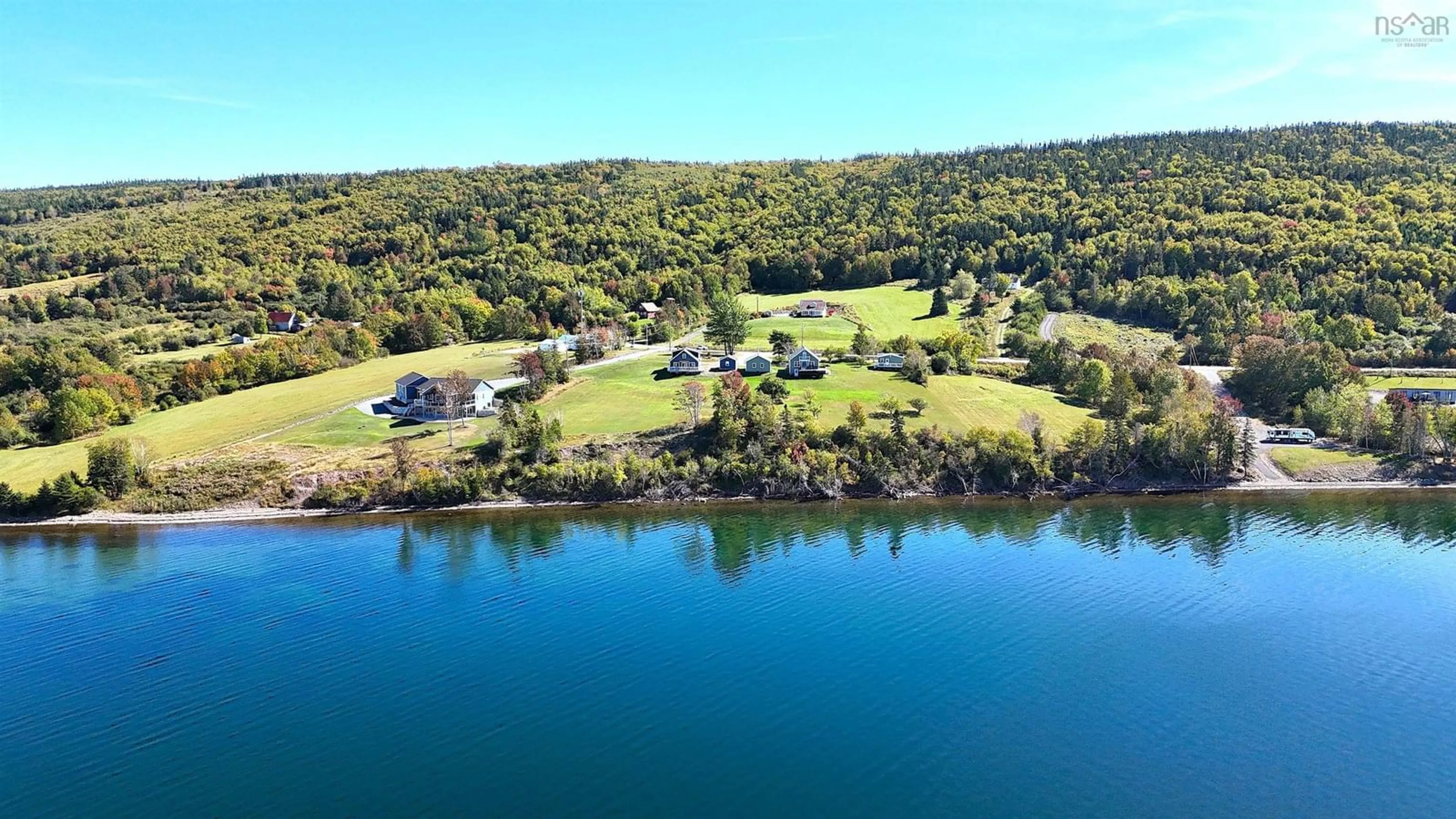 A pic from outside/outdoor area/front of a property/back of a property/a pic from drone, water/lake/river/ocean view for 3359 West Bay Rd, St. Georges Channel Nova Scotia B0E 3K0