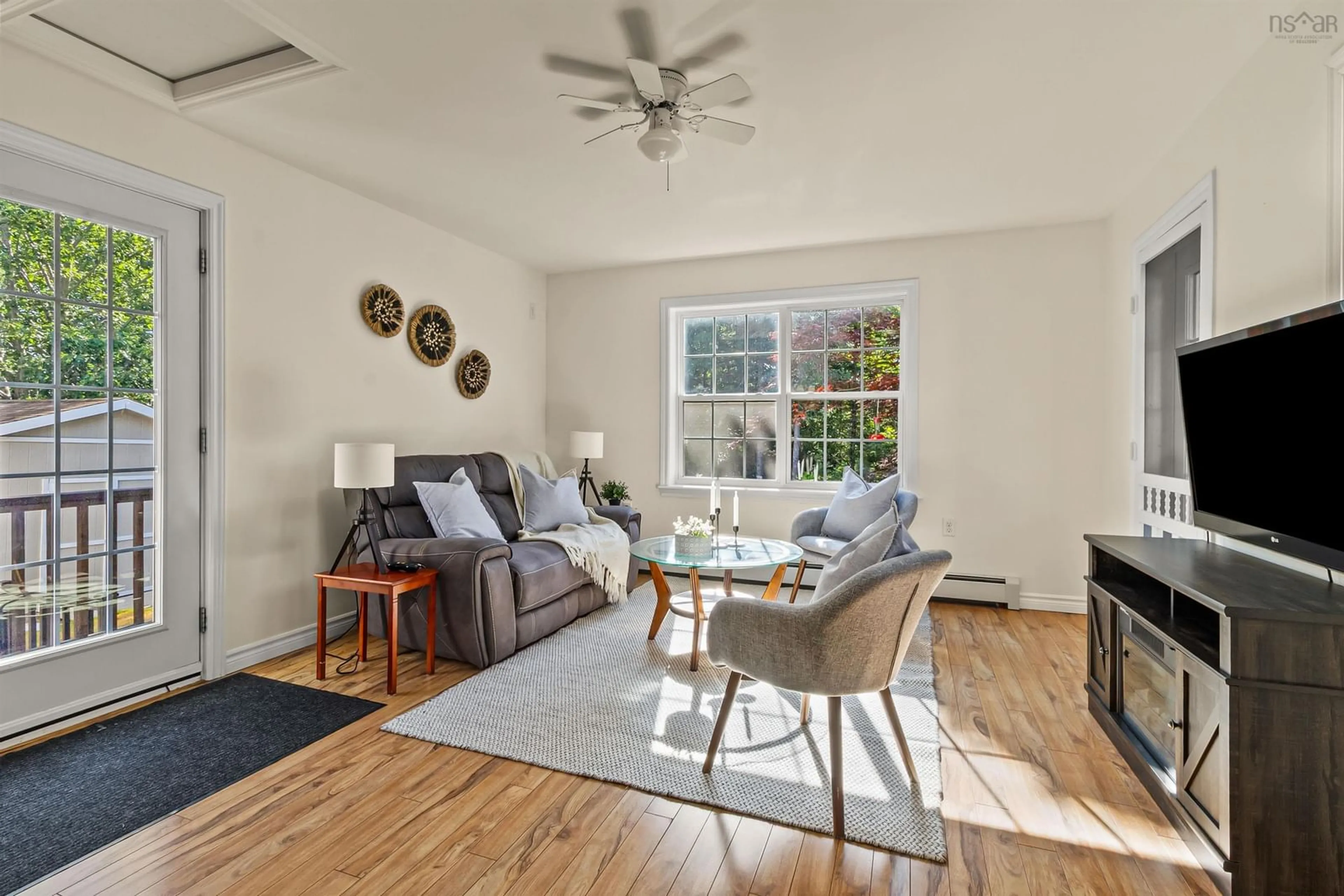 Living room with furniture, wood/laminate floor for 100 Elva Crt, Tantallon Nova Scotia B3Z 4M4