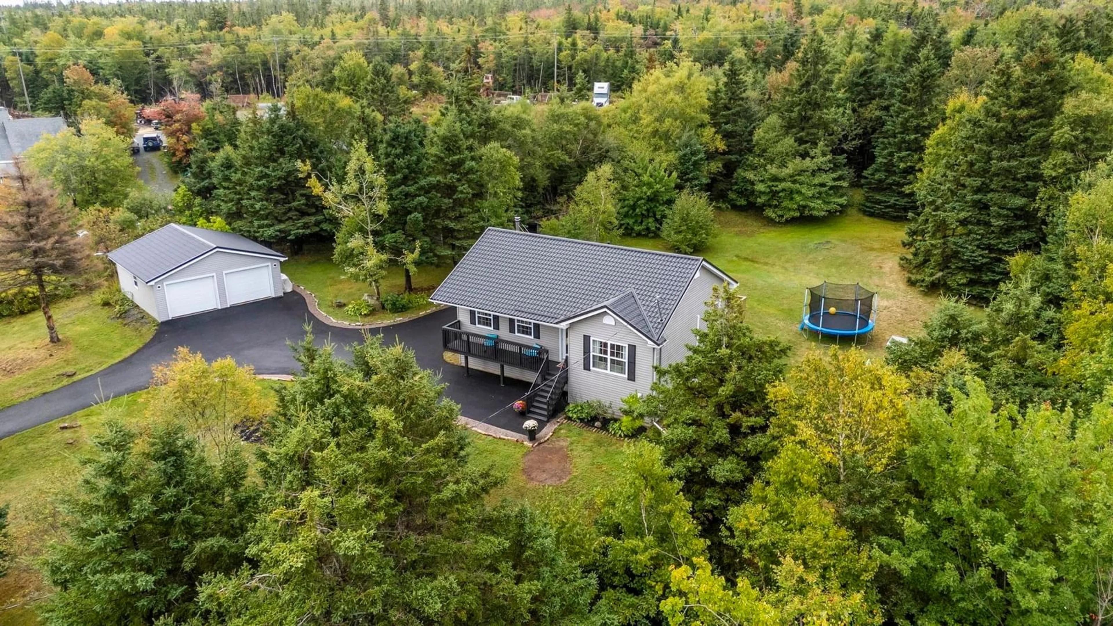 A pic from outside/outdoor area/front of a property/back of a property/a pic from drone, forest/trees view for 2266/2270 Cow Bay Rd, Cow Bay Nova Scotia B3G 1K8