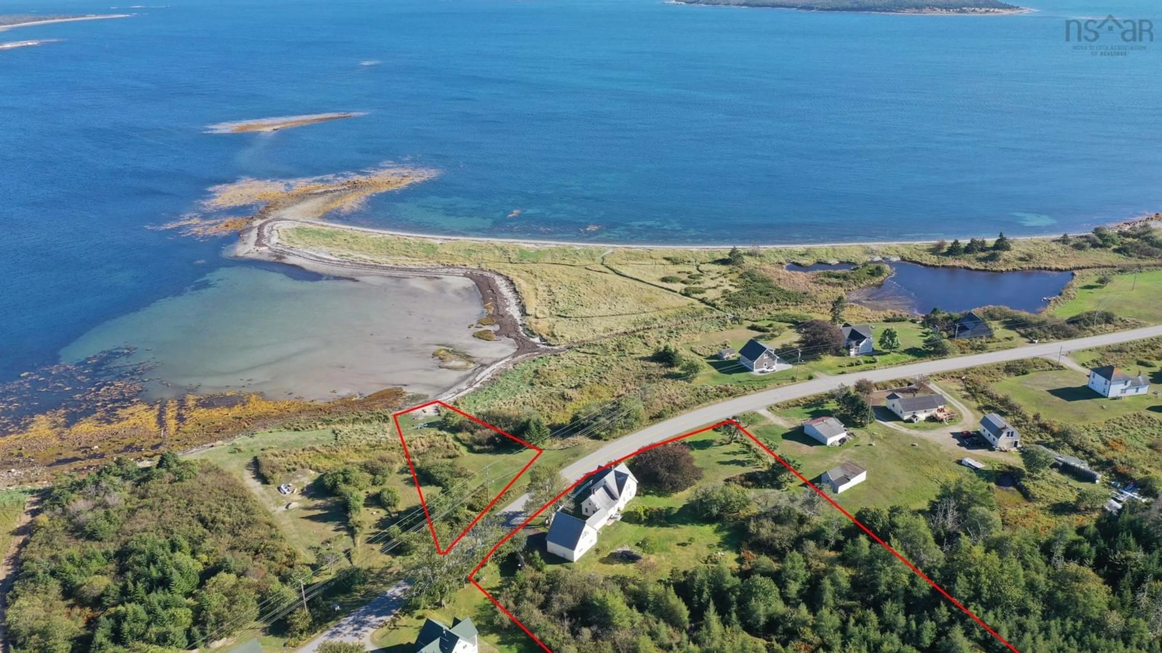 A pic from outside/outdoor area/front of a property/back of a property/a pic from drone, water/lake/river/ocean view for 5096 Shore Rd, North East Harbour Nova Scotia B0W 2E0