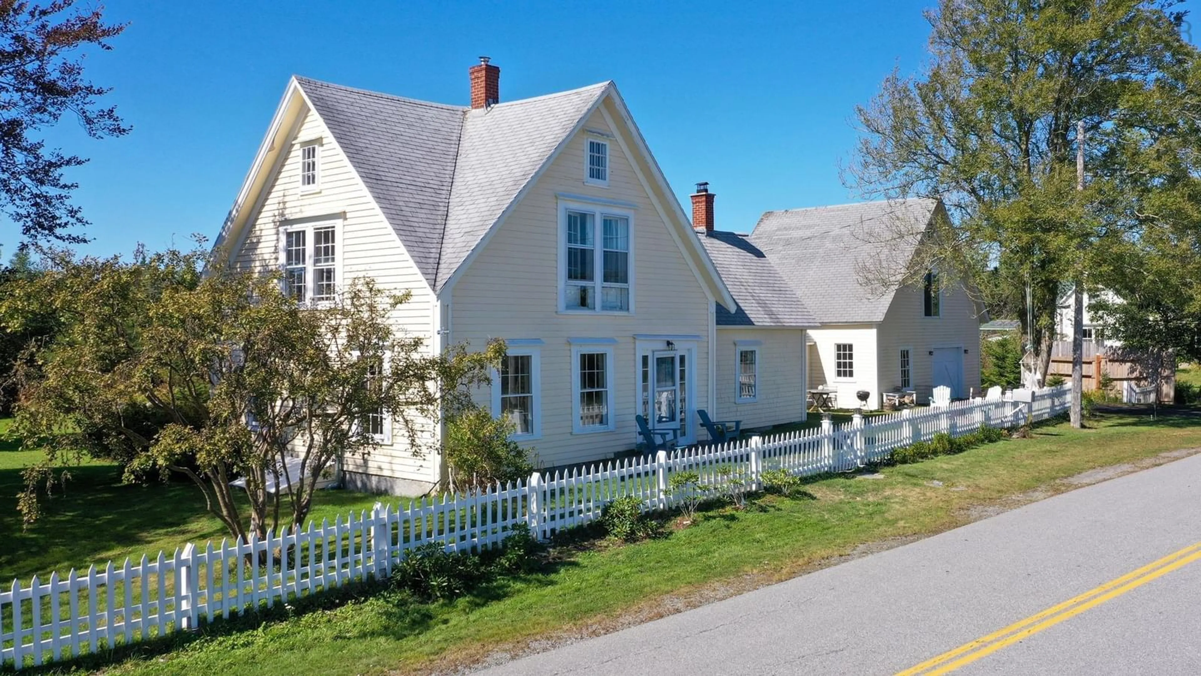 A pic from outside/outdoor area/front of a property/back of a property/a pic from drone, street for 5096 Shore Rd, North East Harbour Nova Scotia B0W 2E0