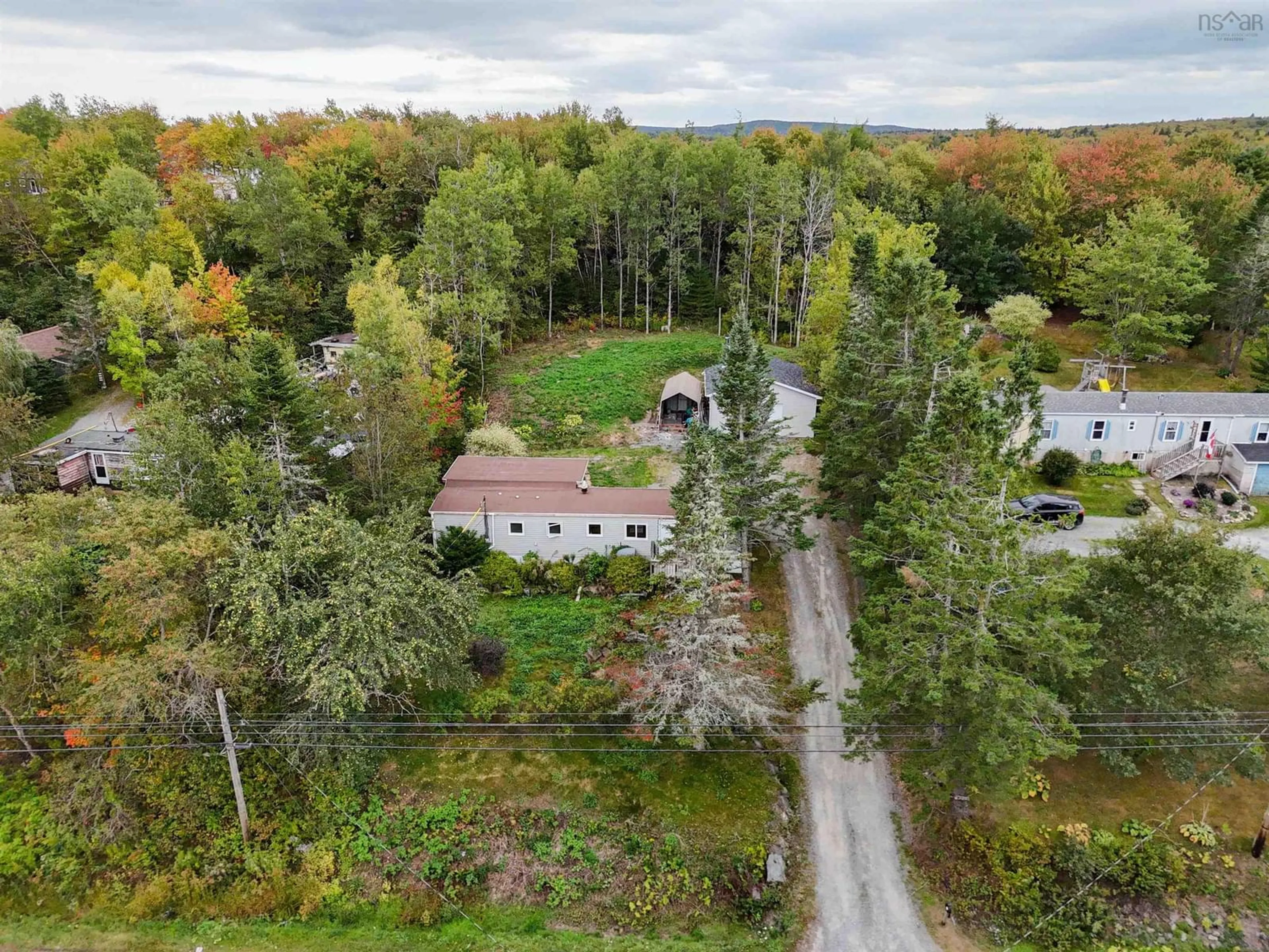 A pic from outside/outdoor area/front of a property/back of a property/a pic from drone, forest/trees view for 8252 Highway 1, Ardoise Nova Scotia B0N 1L0