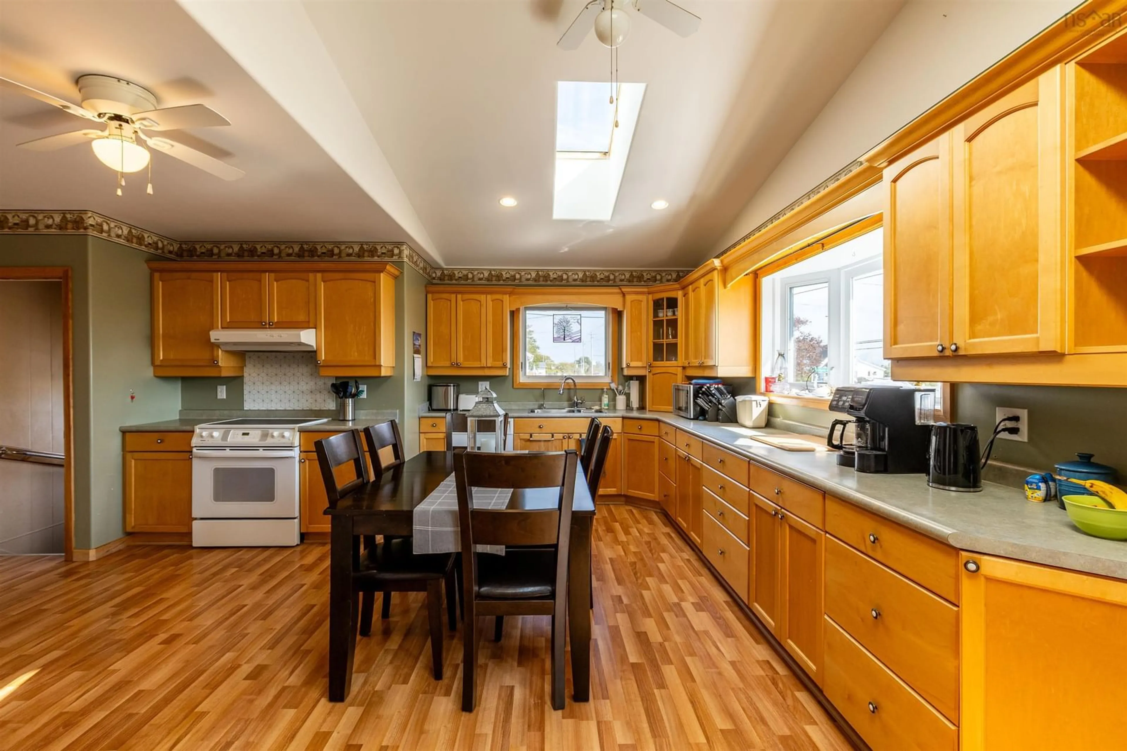 Open concept kitchen, wood/laminate floor for 1192 Highway 335 Hwy, Middle West Pubnico Nova Scotia B0W 2M0