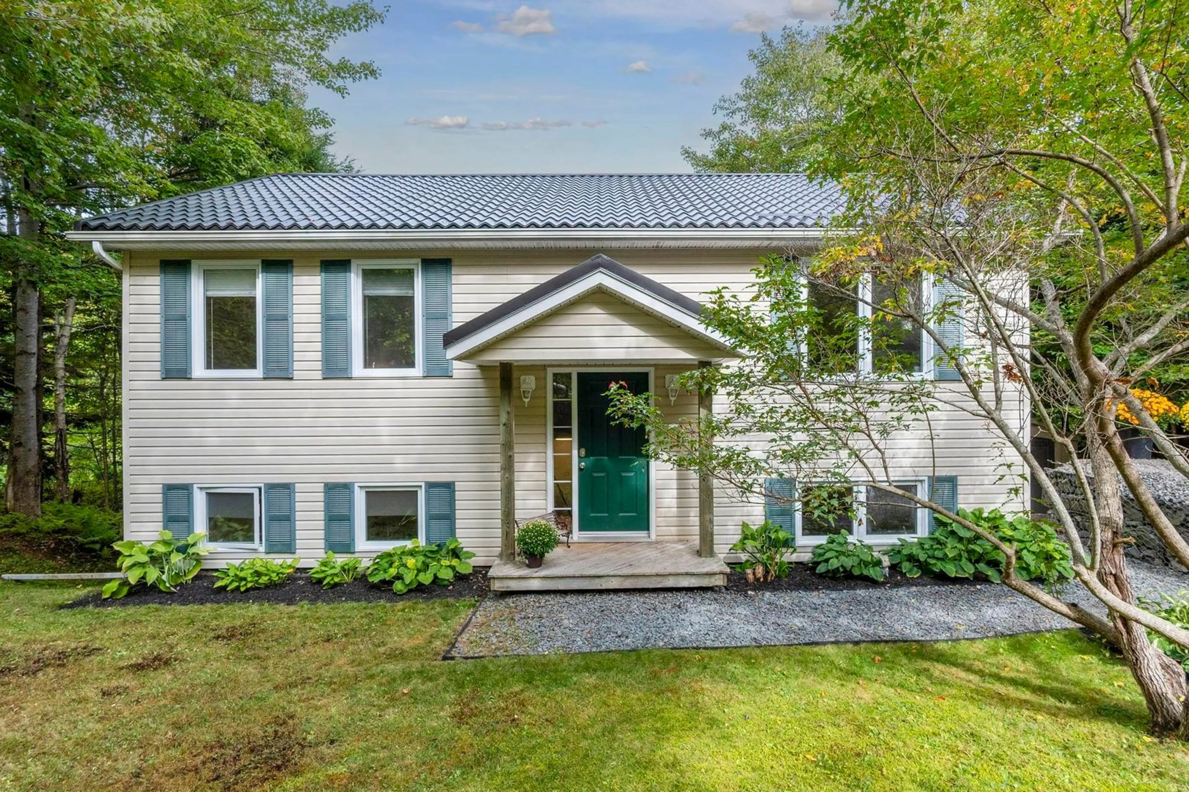 Home with vinyl exterior material, street for 1309 Myra Rd, Porters Lake Nova Scotia B3E 1G9