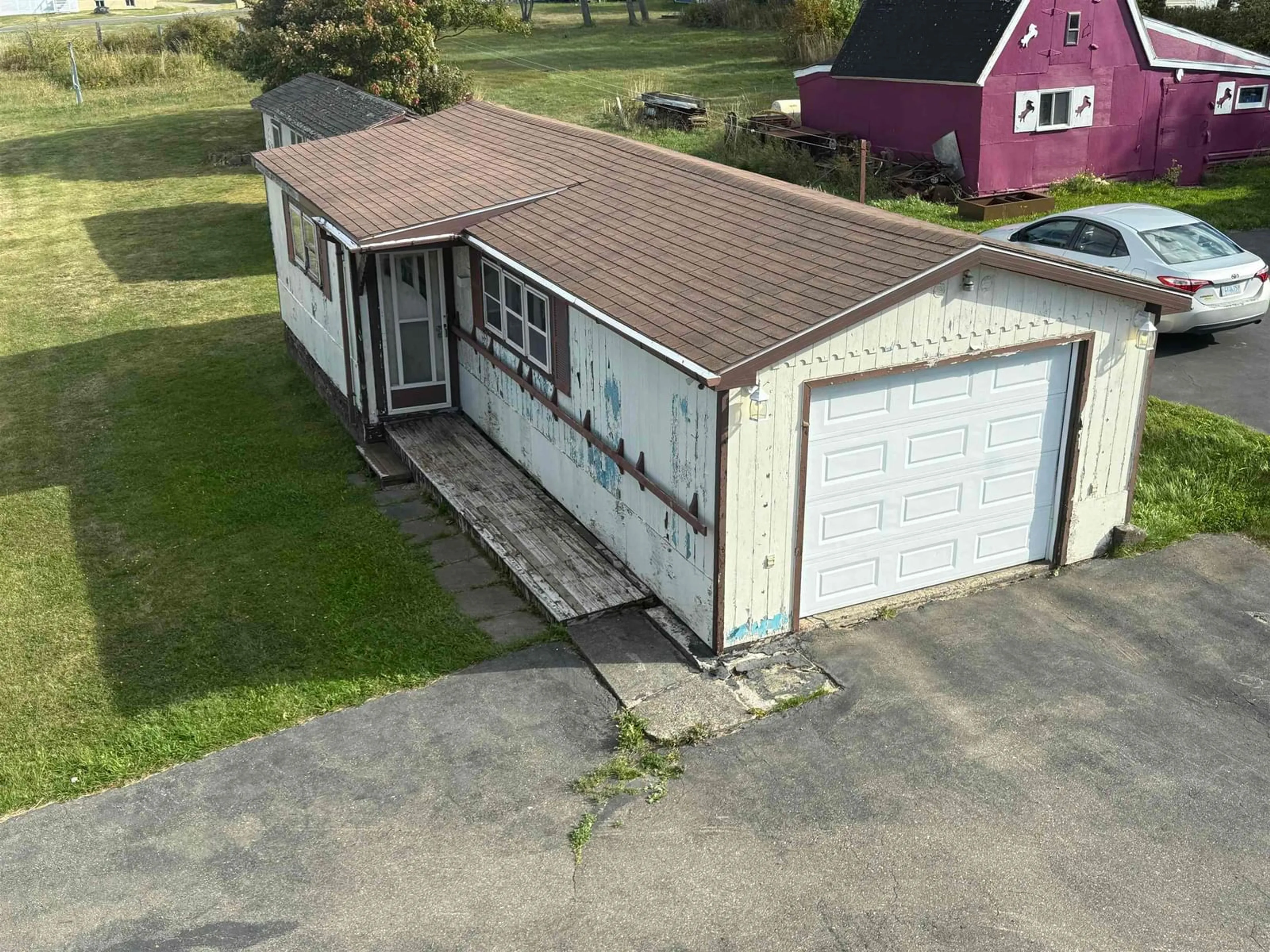 A pic from outside/outdoor area/front of a property/back of a property/a pic from drone, building for 690 St. Joseph St, New Waterford Nova Scotia B1H 4G6
