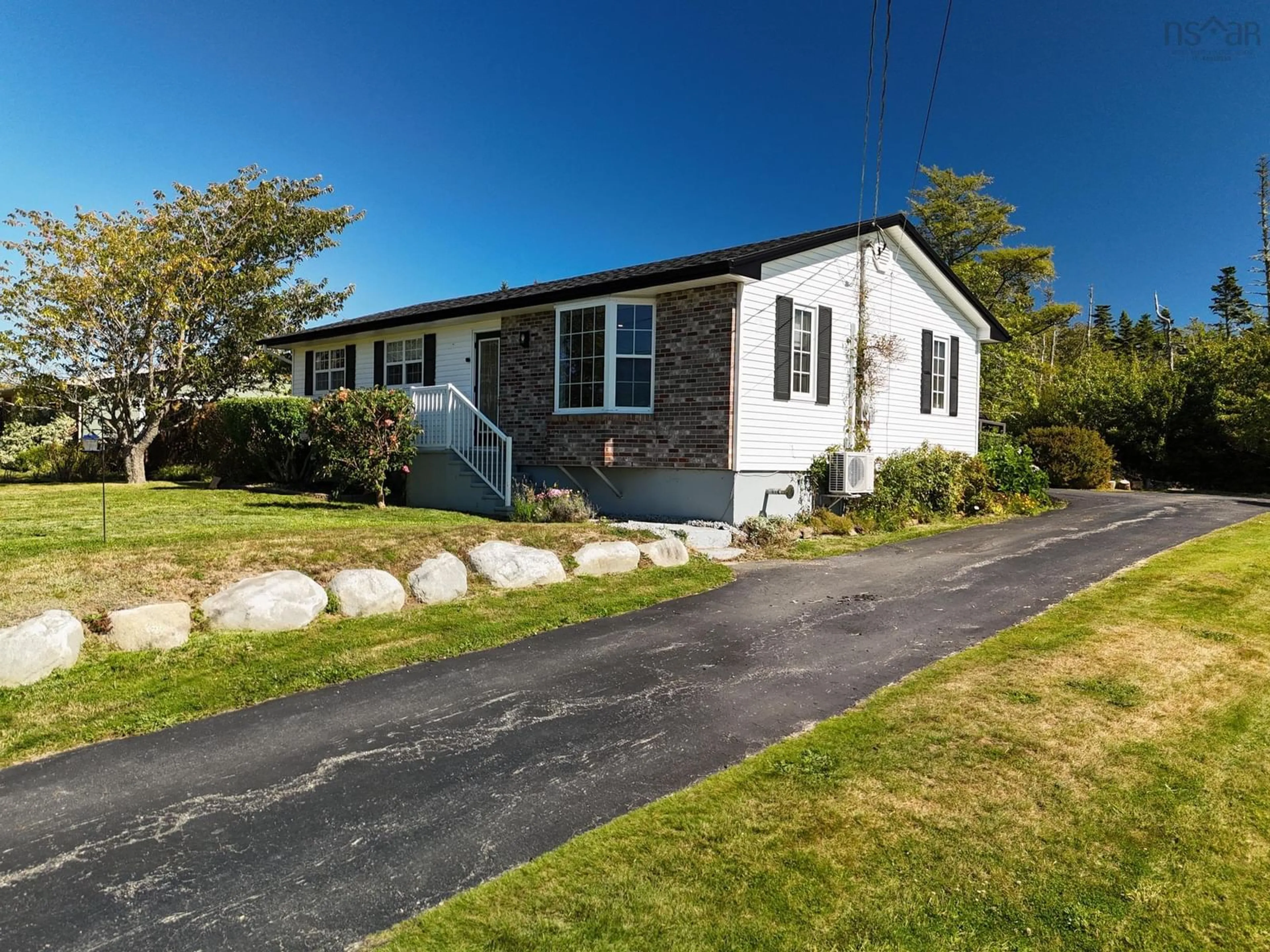 Home with vinyl exterior material, street for 309 Highway 330, North East Point Nova Scotia B0W 3P0