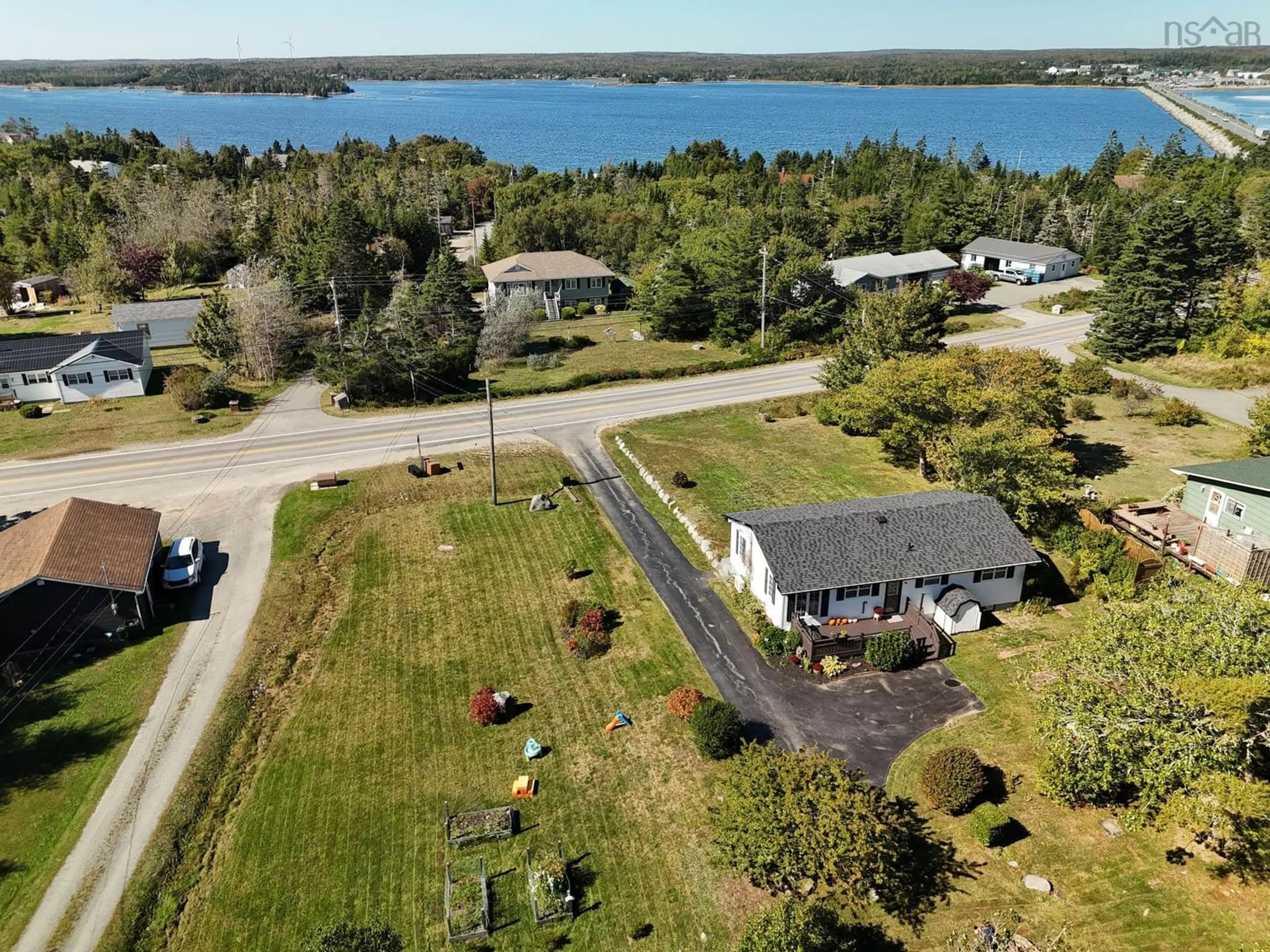 A pic from outside/outdoor area/front of a property/back of a property/a pic from drone, water/lake/river/ocean view for 309 Highway 330, North East Point Nova Scotia B0W 3P0