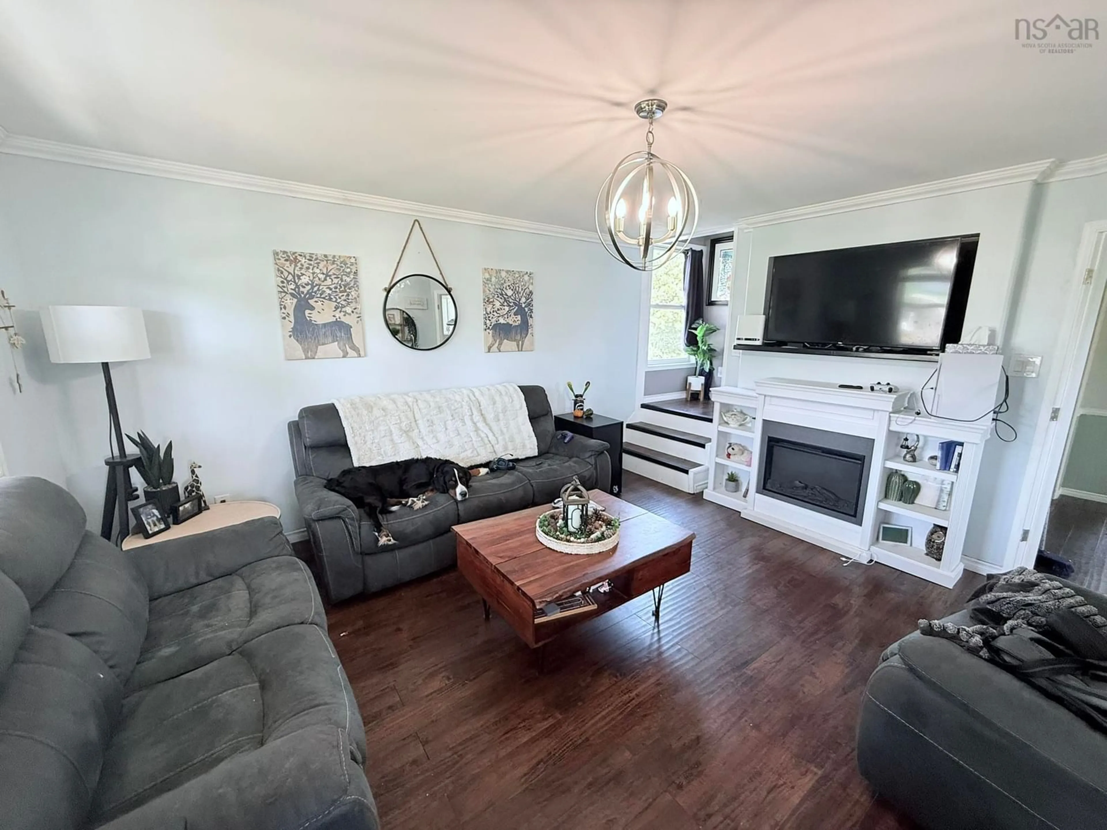 Living room with furniture, wood/laminate floor for 693 Truro Heights Rd, Truro Heights Nova Scotia B6L 1Y3