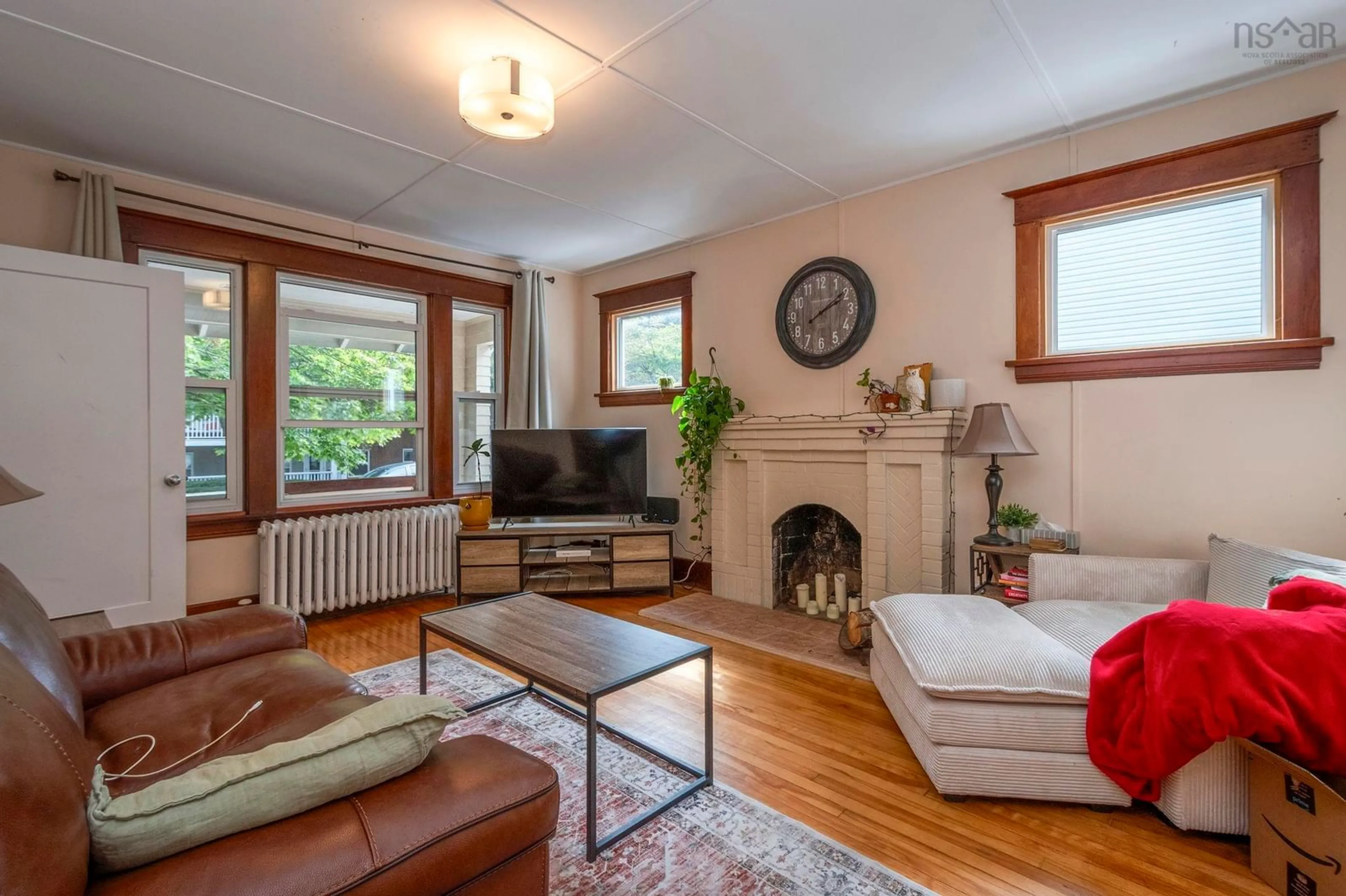 Living room with furniture, wood/laminate floor for 5231 Tobin St, Halifax Nova Scotia B3J 1A4