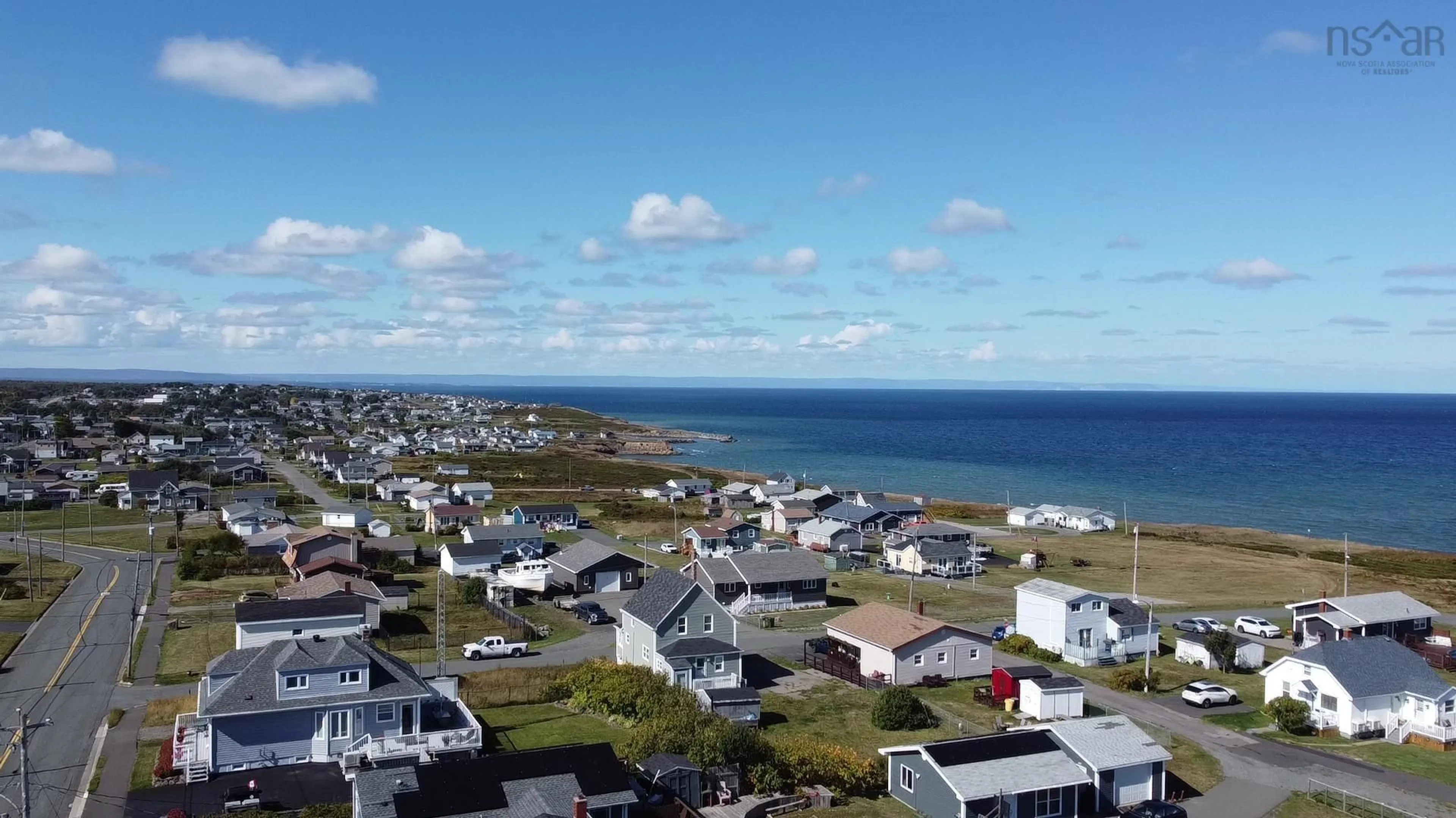 A pic from outside/outdoor area/front of a property/back of a property/a pic from drone, water/lake/river/ocean view for 3057 Hinchey Ave, New Waterford Nova Scotia B1H 2K5