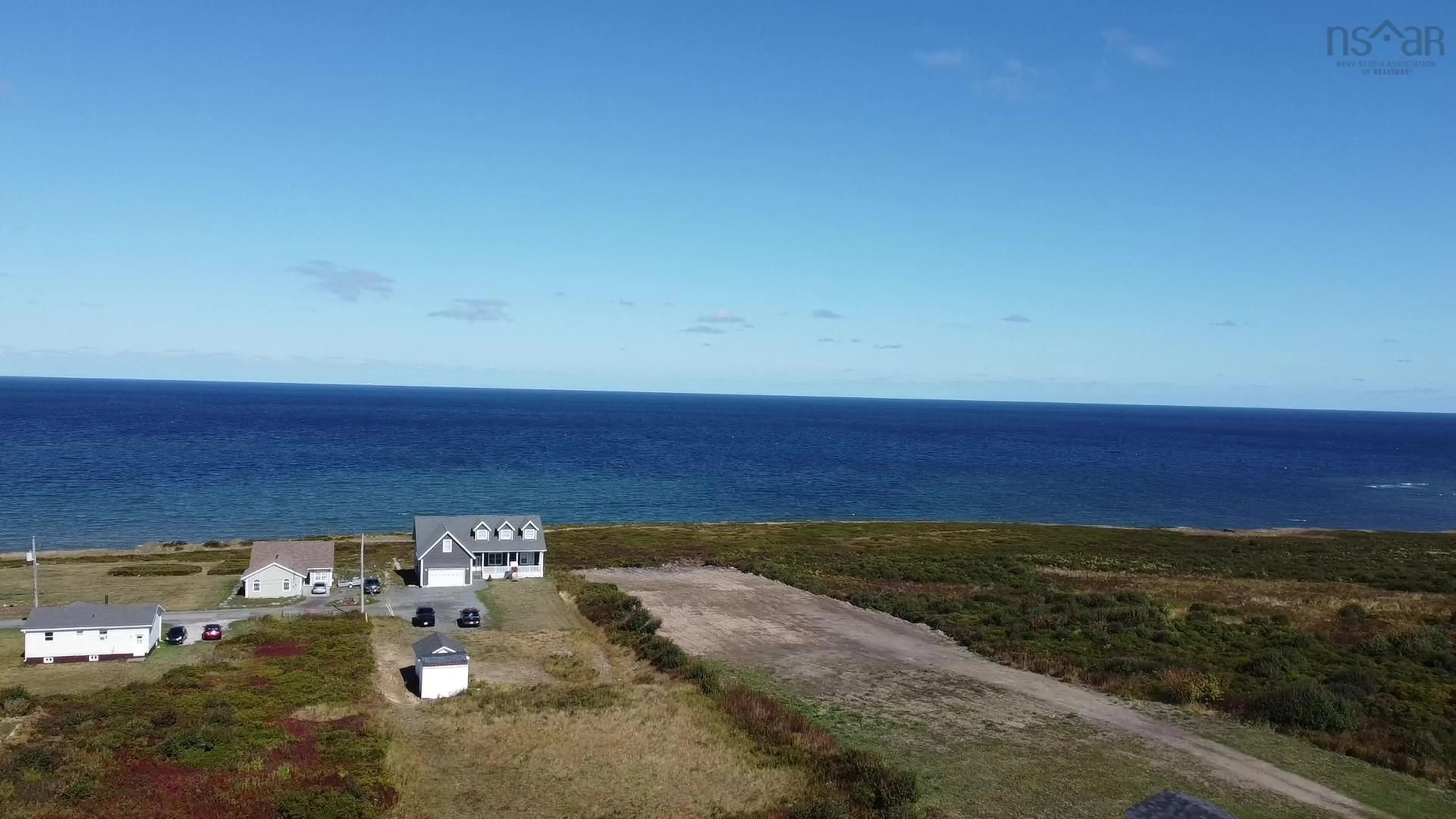 A pic from outside/outdoor area/front of a property/back of a property/a pic from drone, water/lake/river/ocean view for 3057 Hinchey Ave, New Waterford Nova Scotia B1H 2K5