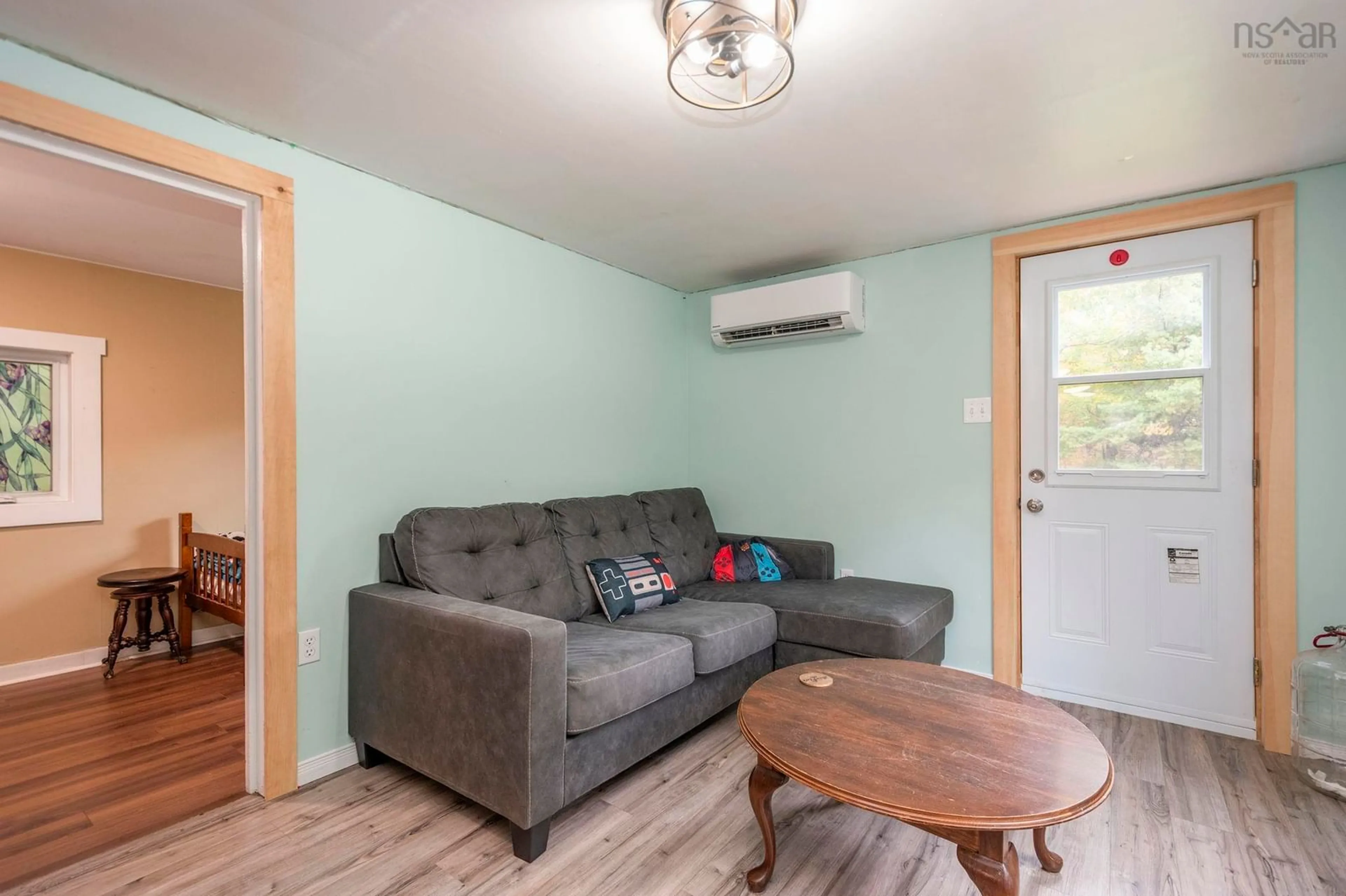 Living room with furniture, wood/laminate floor for 4023 Highway 236, Kennetcook Nova Scotia B0N 1T0