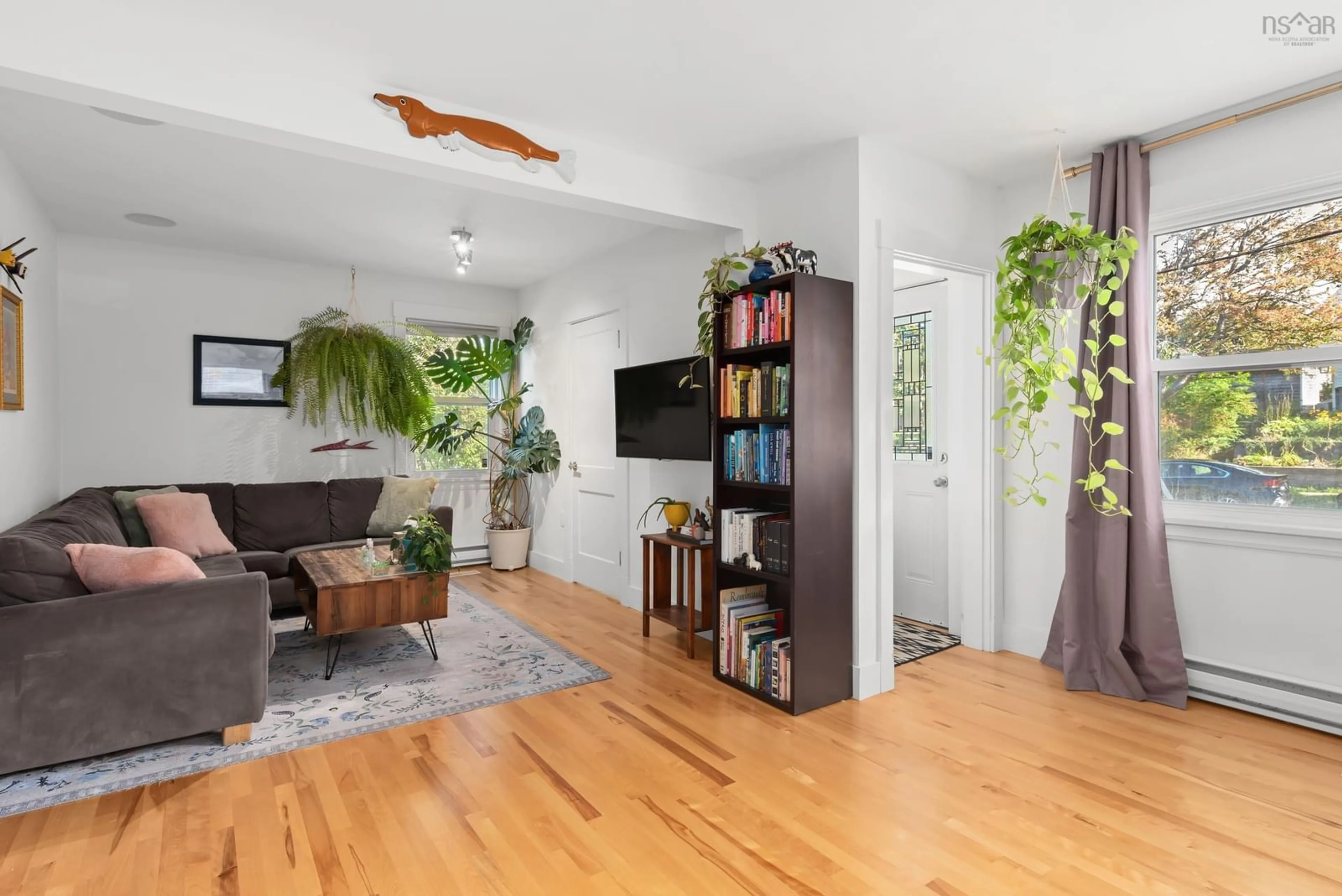Living room with furniture, wood/laminate floor for 3692 Basinview Dr, Halifax Nova Scotia B3K 4Z8