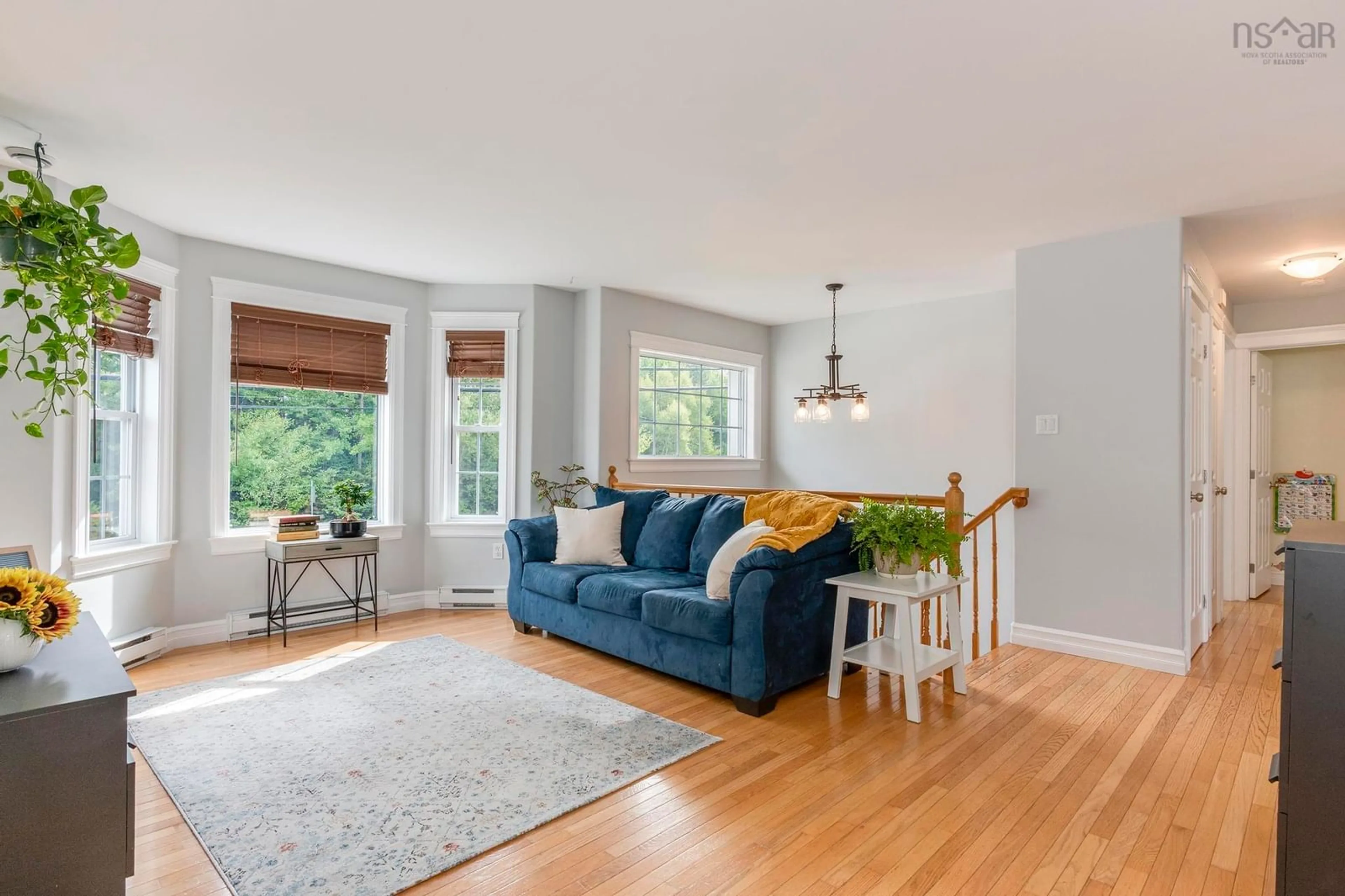 Living room with furniture, wood/laminate floor for 1200 Sackville Dr, Middle Sackville Nova Scotia B4E 3G1