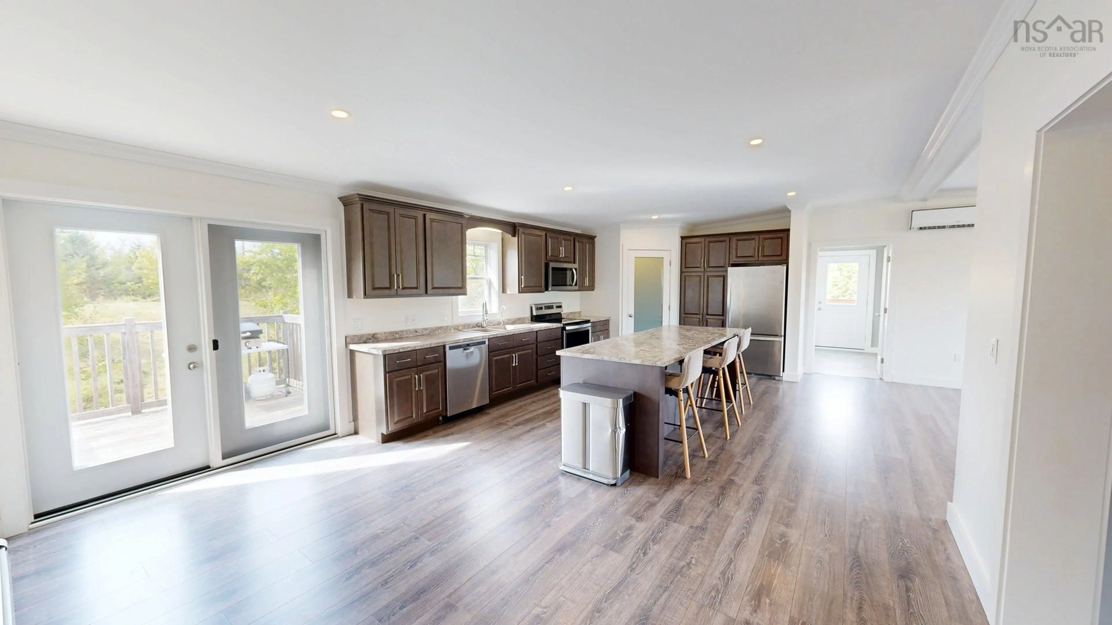 Open concept kitchen, wood/laminate floor for 210 Keltic Drive, Lawrencetown Nova Scotia B2Z 1M5
