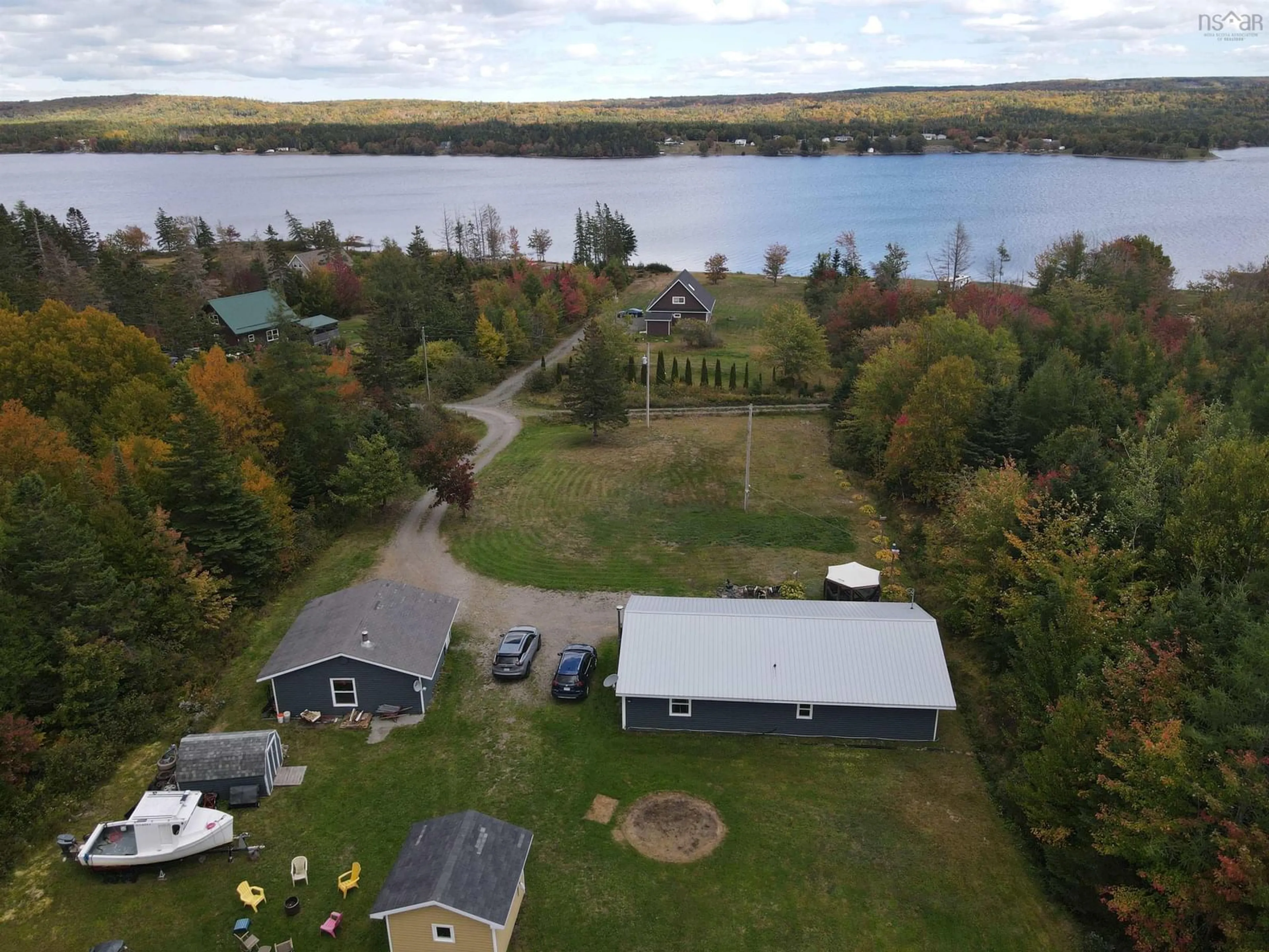A pic from outside/outdoor area/front of a property/back of a property/a pic from drone, water/lake/river/ocean view for 5231 Grand Mira North Rd, Grand Mira North Nova Scotia B1K 1P9