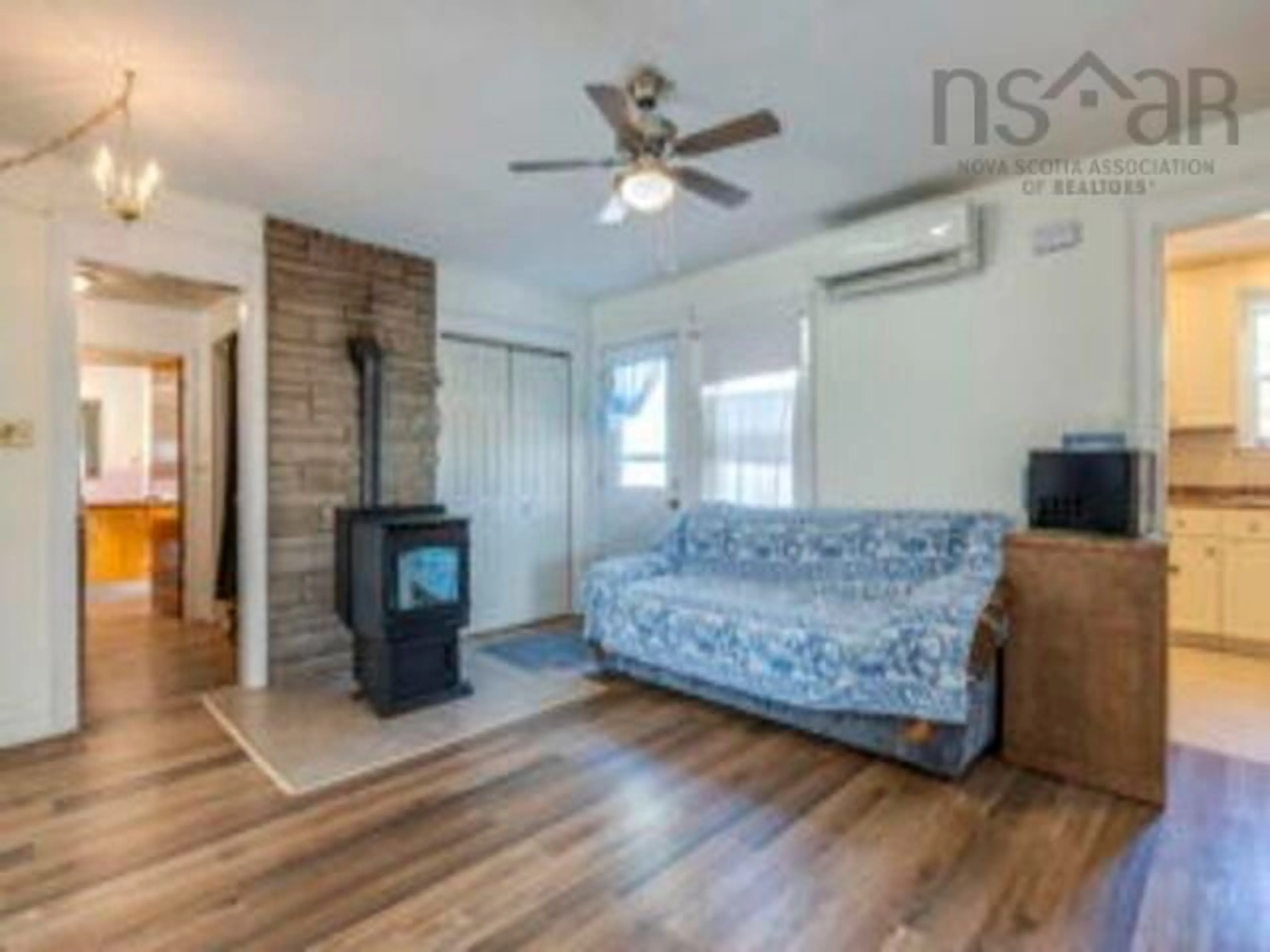 Living room with furniture, wood/laminate floor for 7987 Highway 10, Nictaux South Nova Scotia B0S 1P0