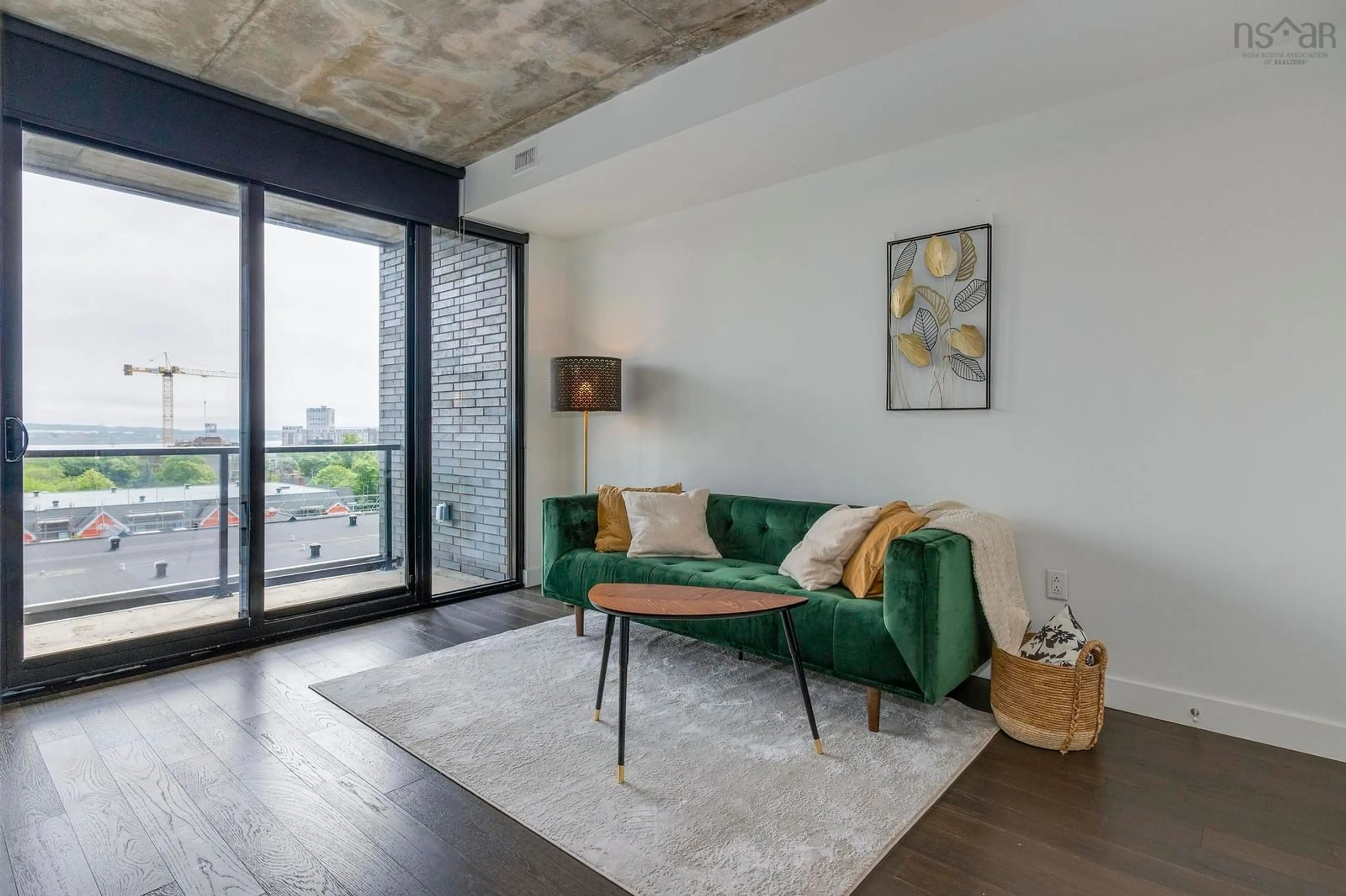Living room with furniture, cement floor for 1048 Wellington St #813, Halifax Nova Scotia B3H 0C2