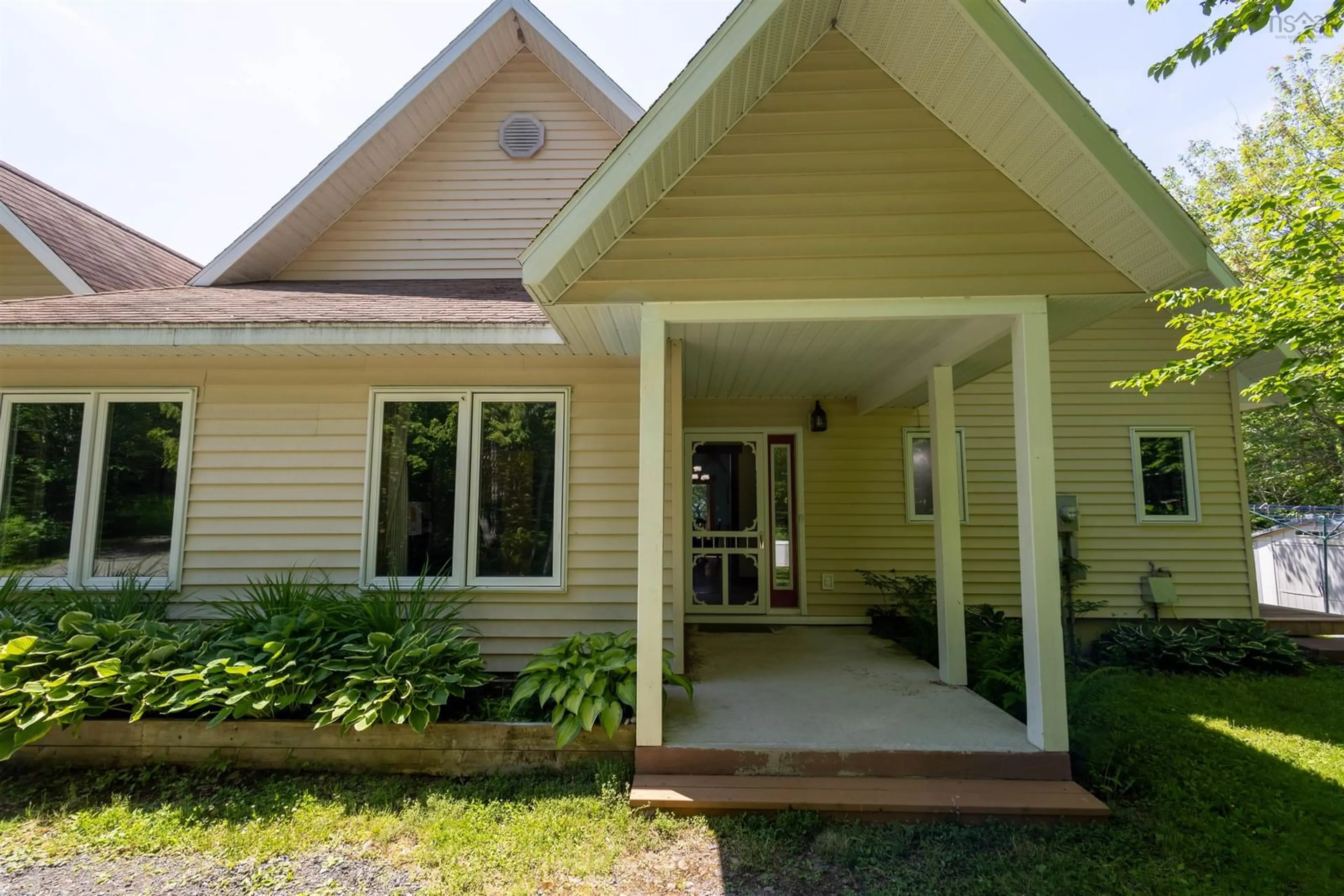 Home with vinyl exterior material, street for 54 Beverlys Hill Rd, Baddeck Inlet Nova Scotia B0E 1B0