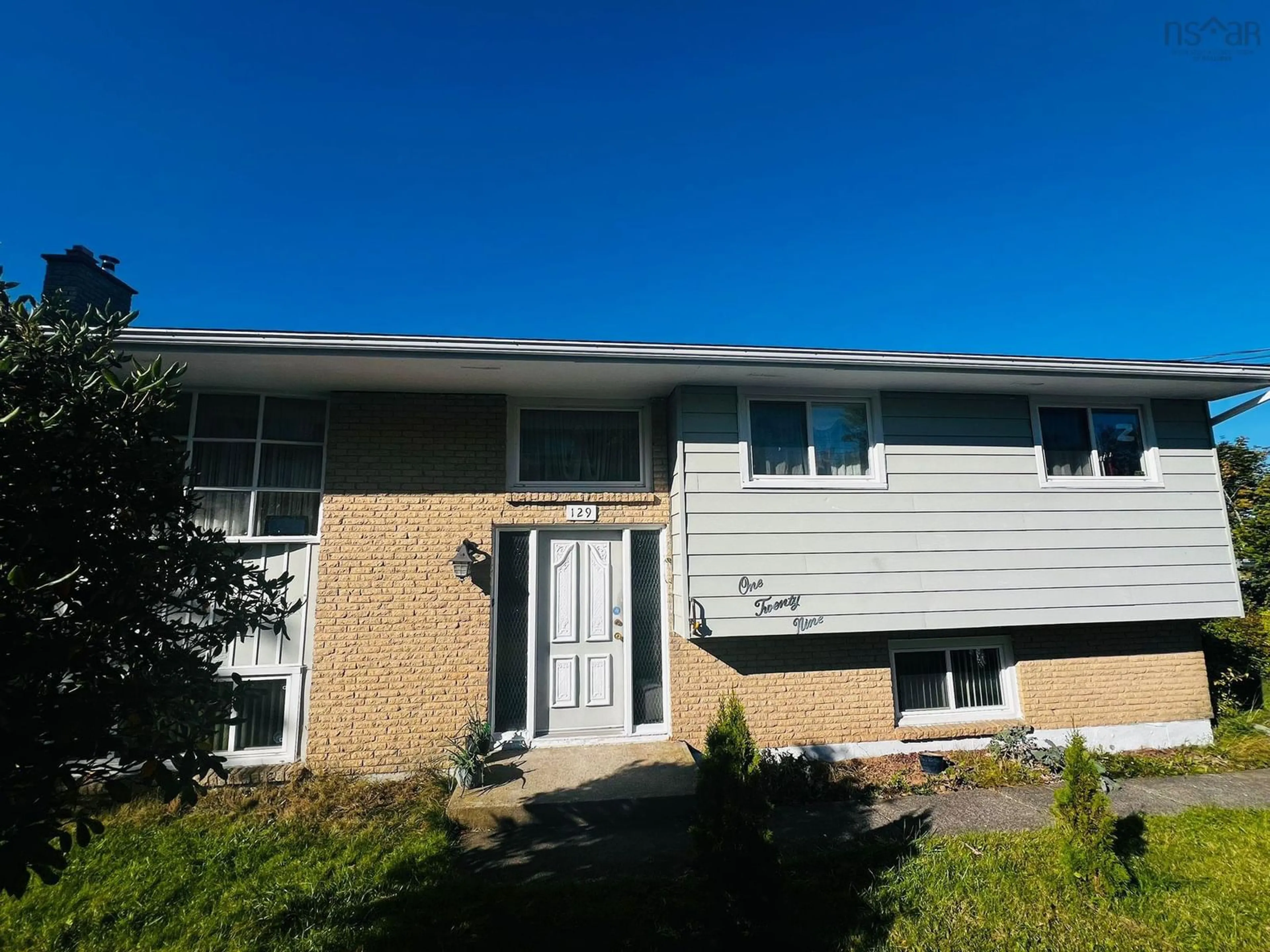 Home with vinyl exterior material, street for 129 Regal Rd, Dartmouth Nova Scotia B2W 4H7