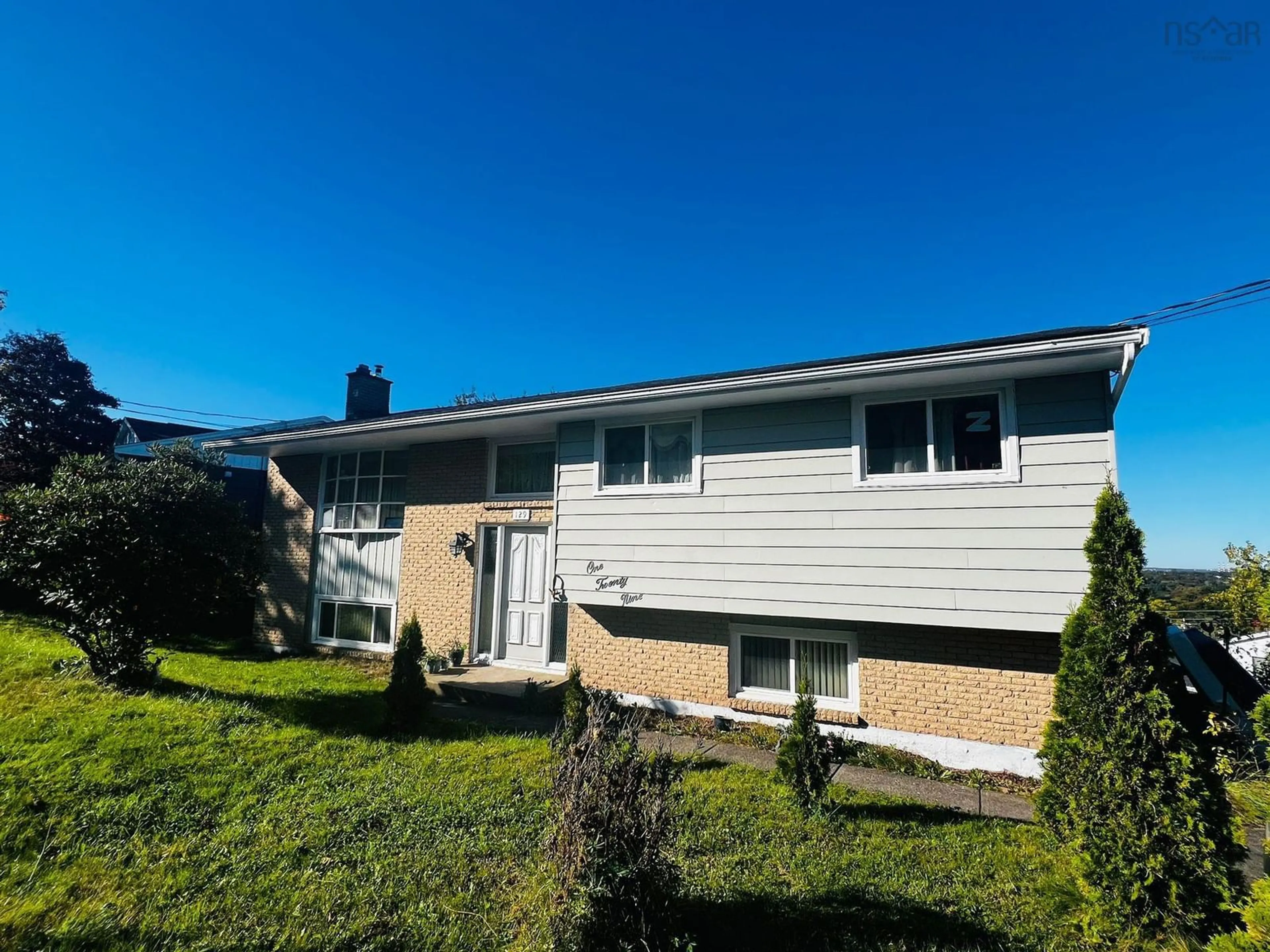 Home with vinyl exterior material, street for 129 Regal Rd, Dartmouth Nova Scotia B2W 4H7