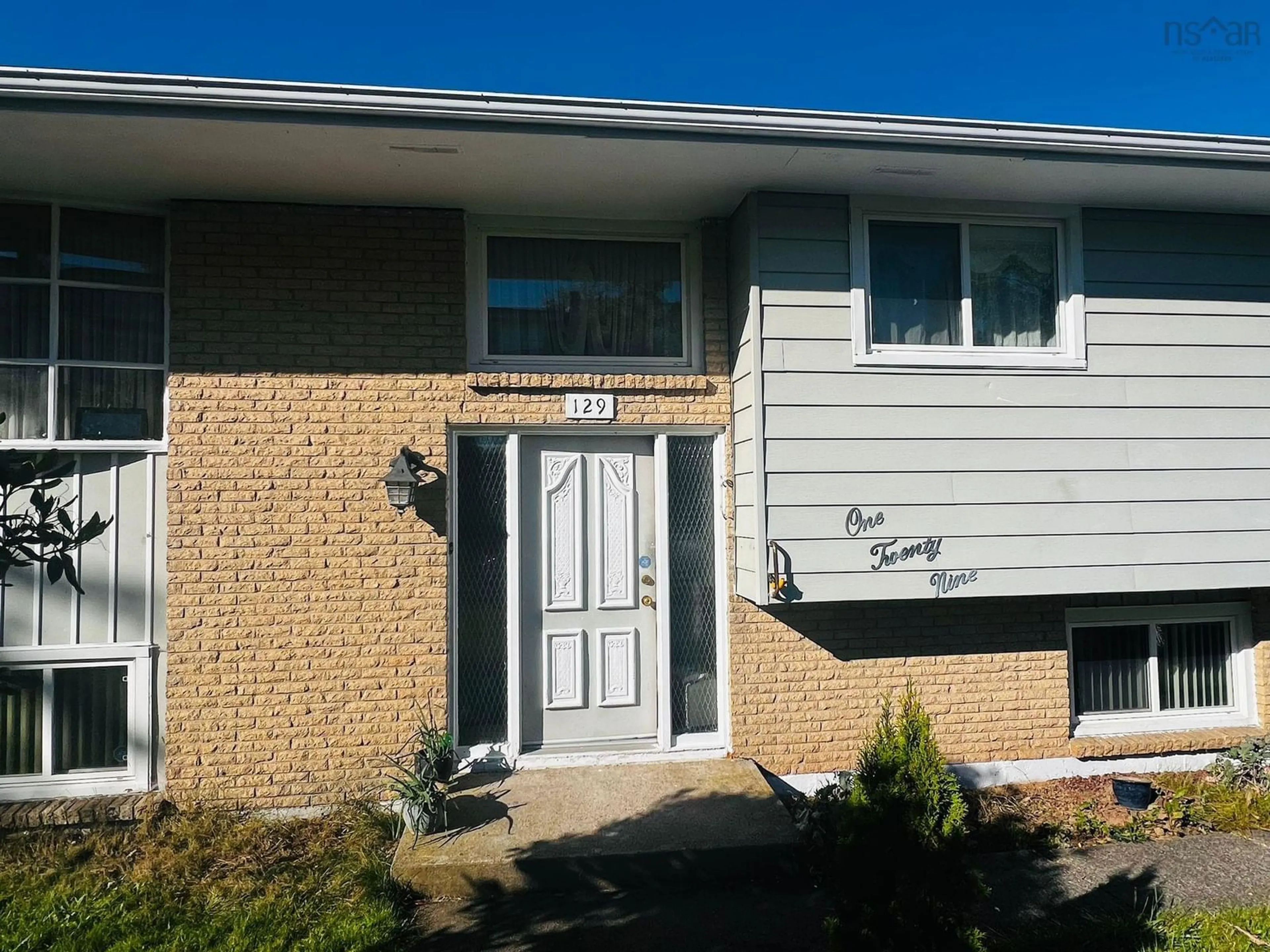Home with vinyl exterior material, street for 129 Regal Rd, Dartmouth Nova Scotia B2W 4H7