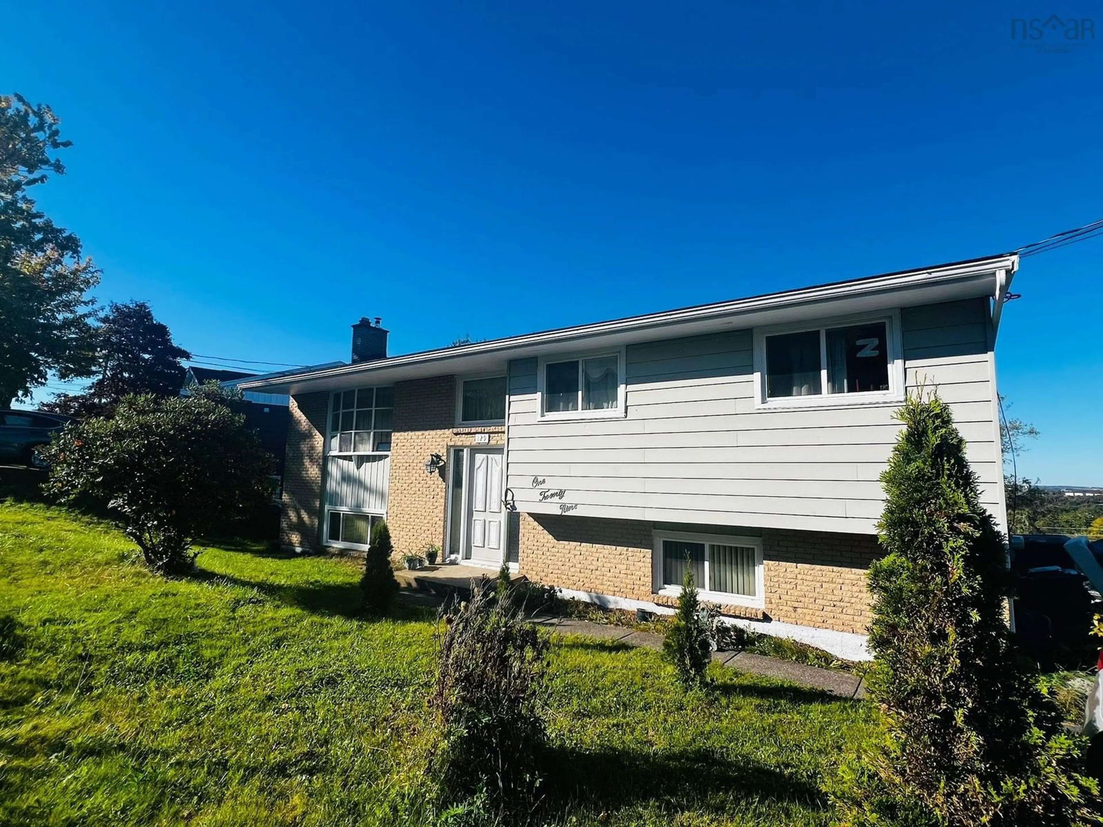 Home with vinyl exterior material, street for 129 Regal Rd, Dartmouth Nova Scotia B2W 4H7