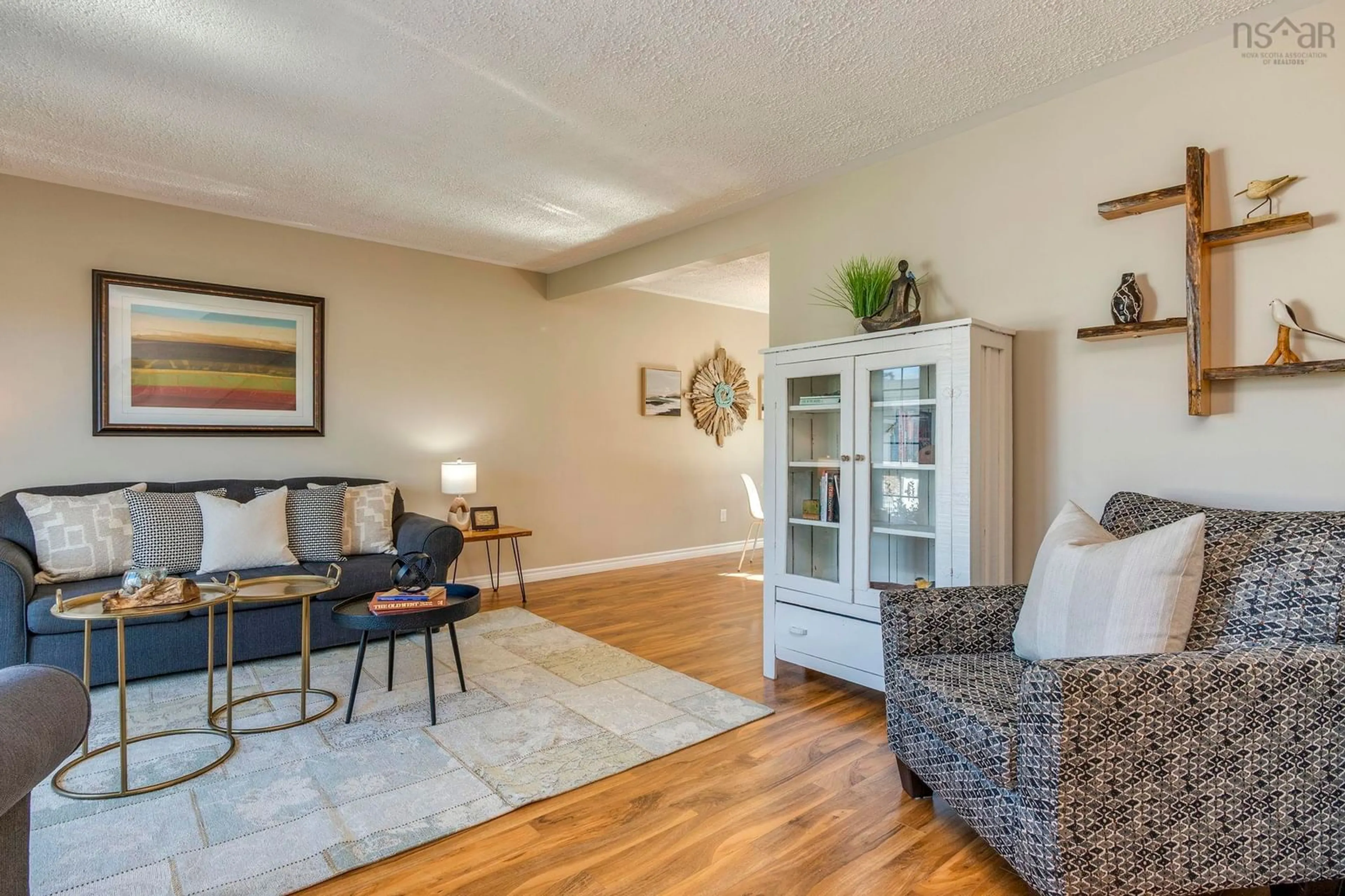 Living room with furniture, wood/laminate floor for 1492 Riverside Dr, Lower Sackville Nova Scotia B4C 2Y8