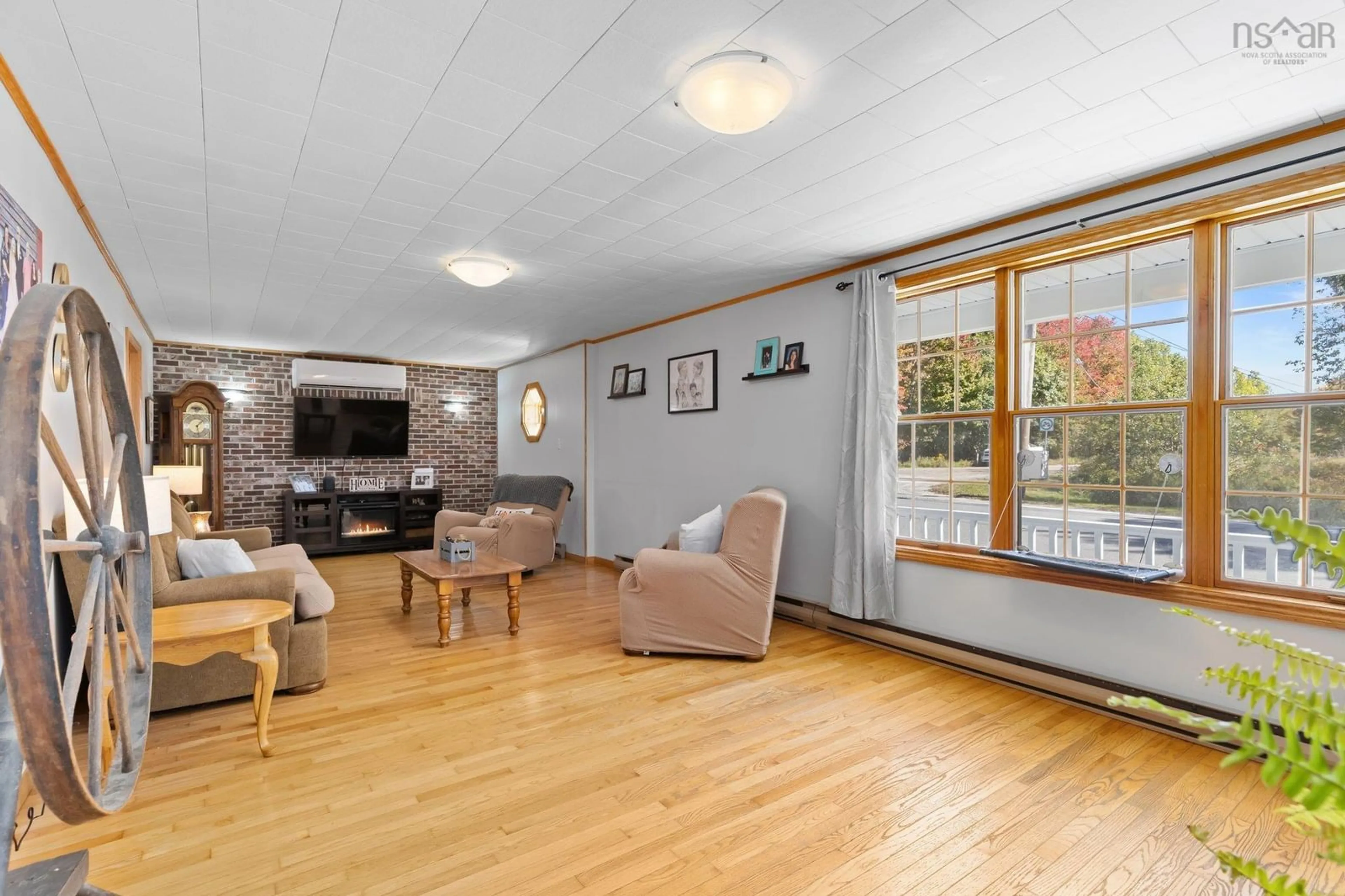 Living room with furniture, wood/laminate floor for 902 Highway 3, Birchtown Nova Scotia B0T 1W0