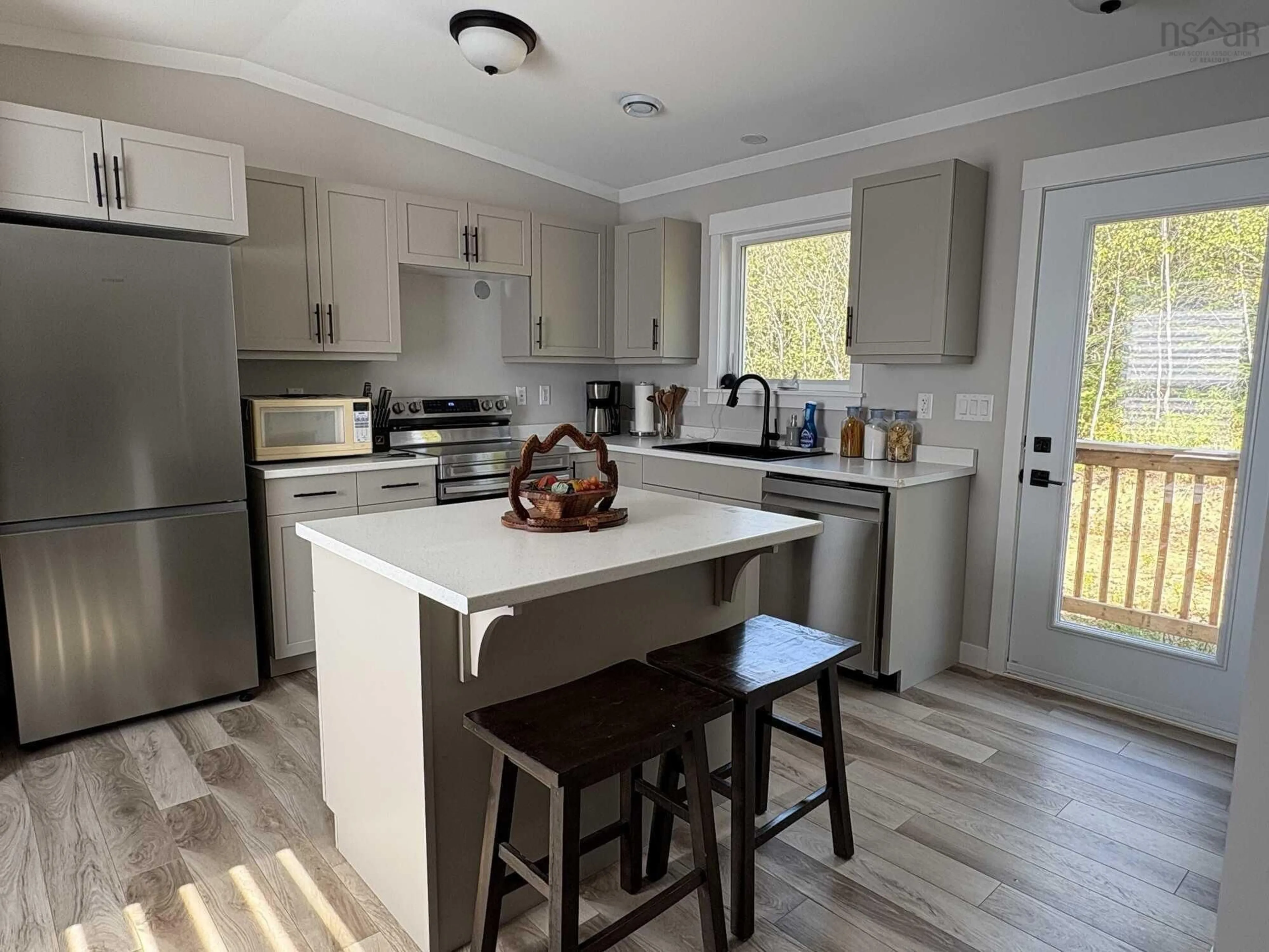 Open concept kitchen, wood/laminate floor for 10 Bryson Lane, Wyses Corner Nova Scotia B0N 1K0