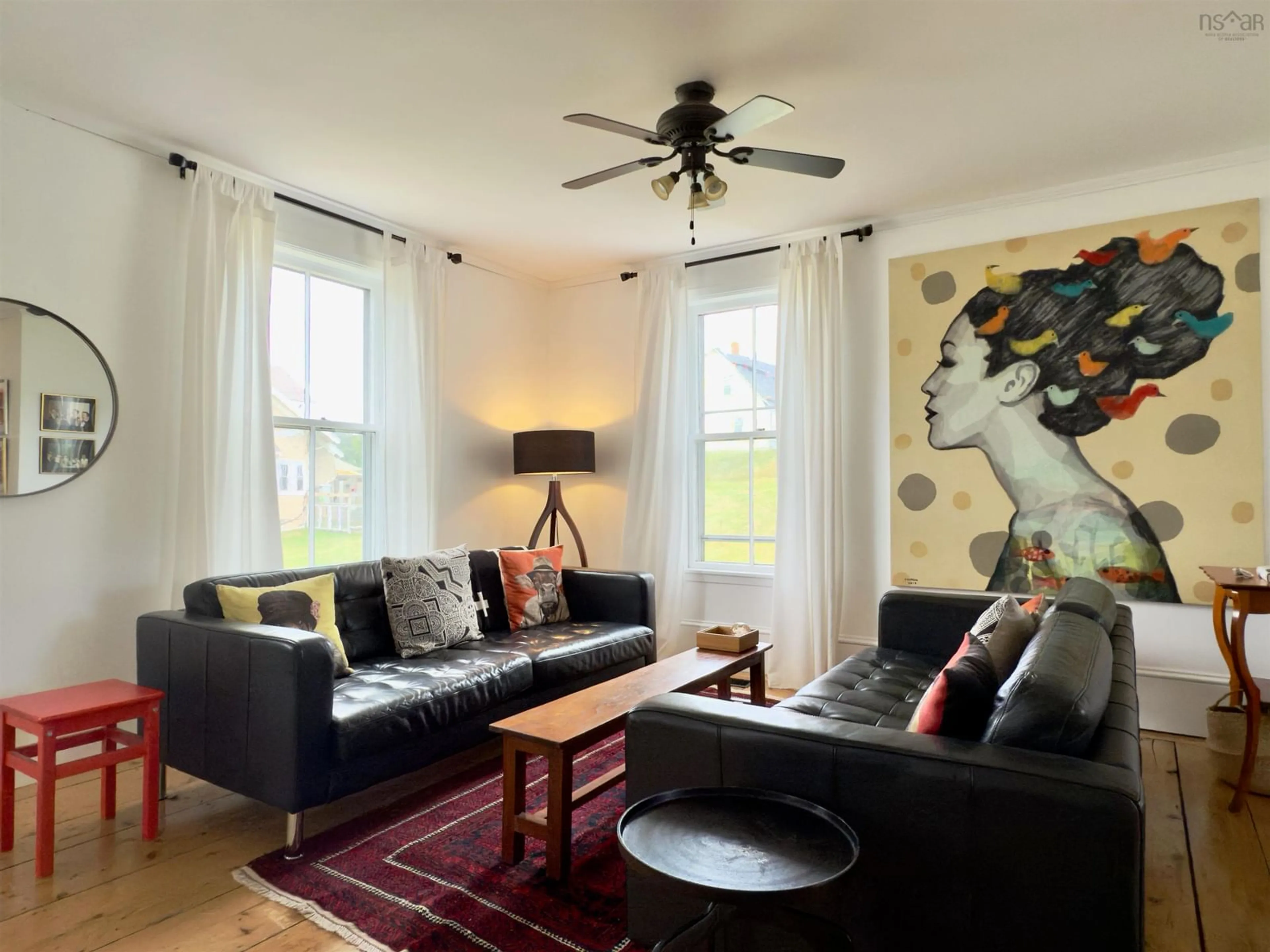 Living room with furniture, wood/laminate floor for 19 Lower Lahave Rd, Riverport Nova Scotia B0J 2W0