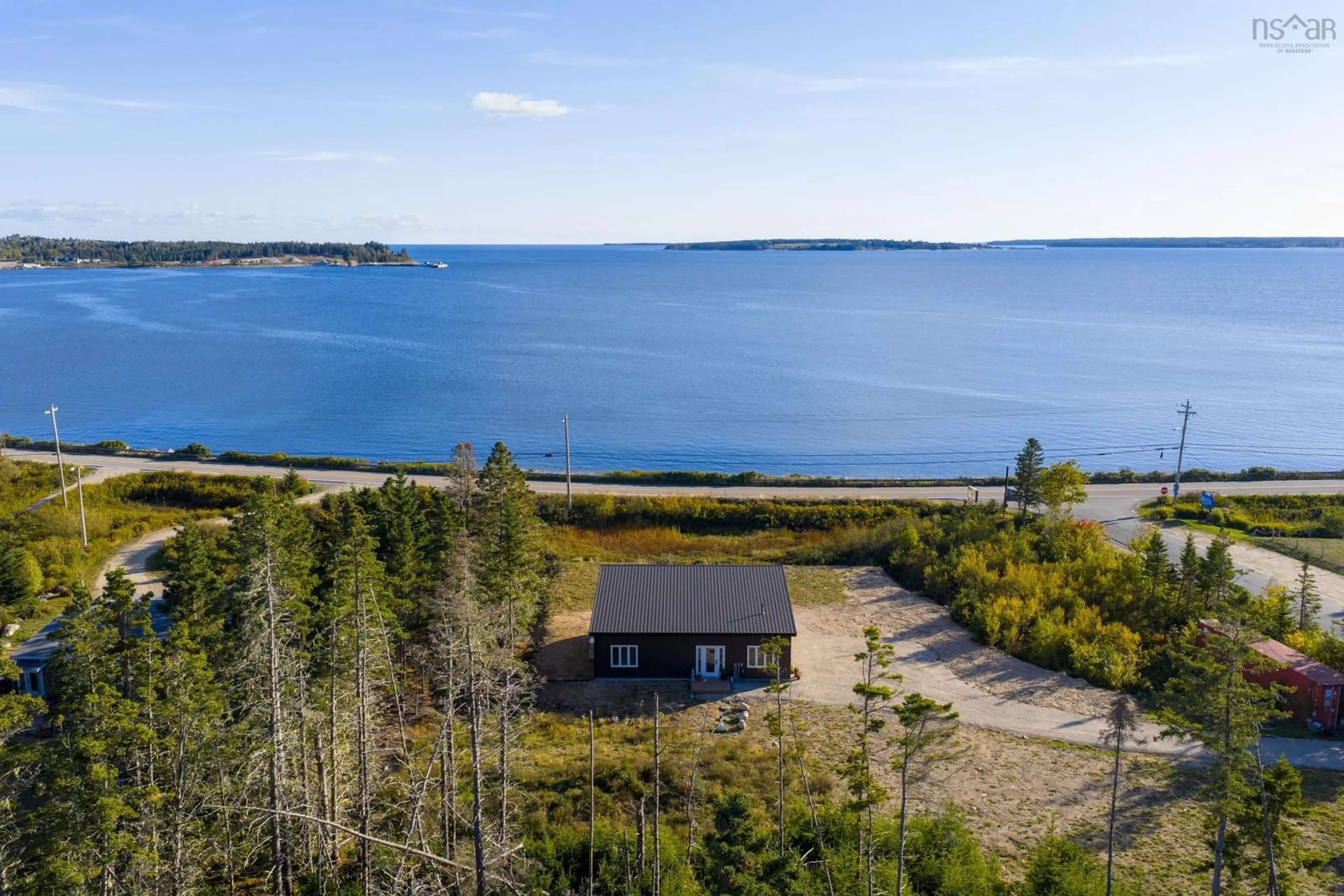 A pic from outside/outdoor area/front of a property/back of a property/a pic from drone, water/lake/river/ocean view for 12 Firehall Rd, Blandford Nova Scotia B0J 1T0
