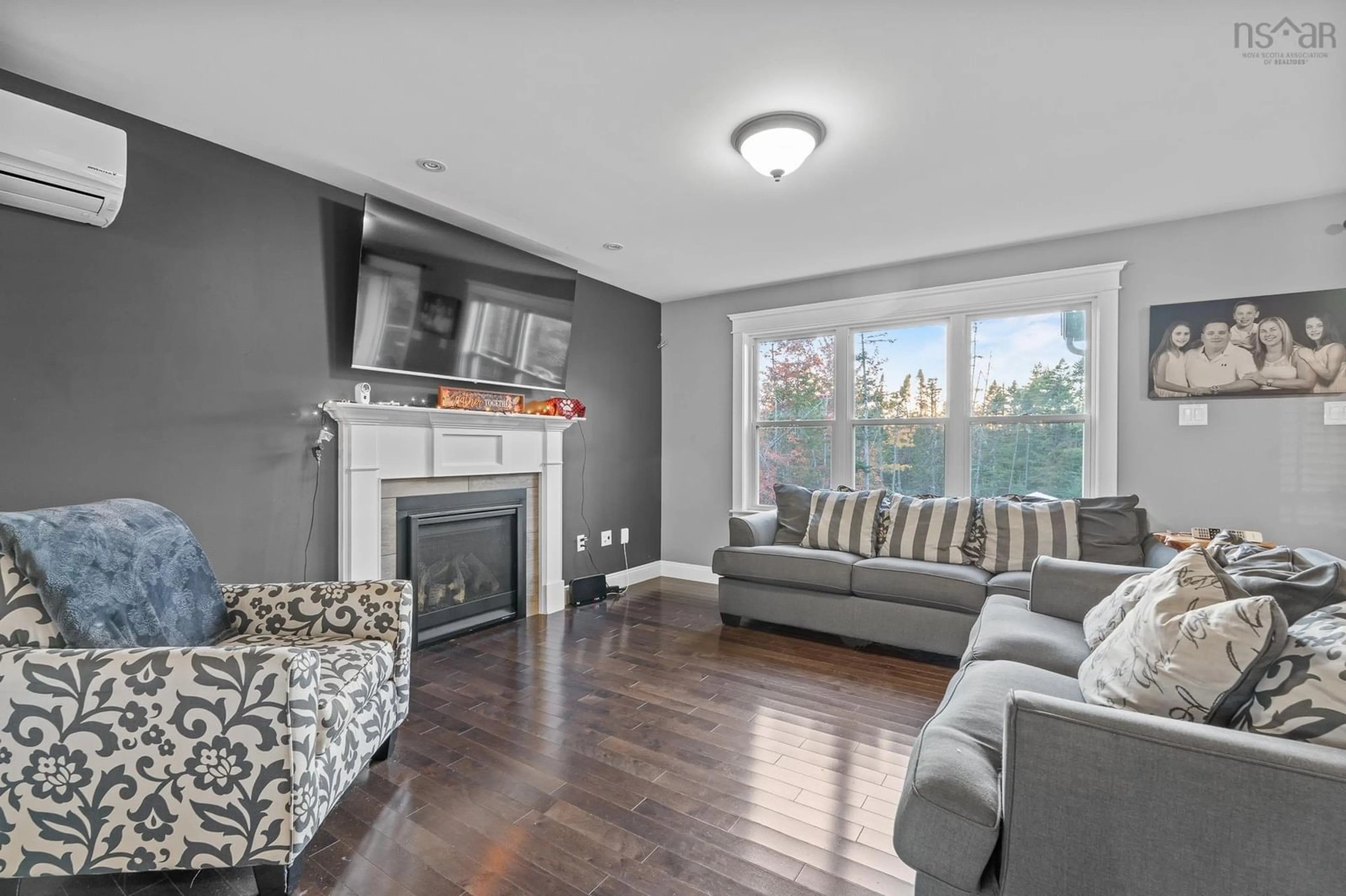 Living room with furniture, wood/laminate floor for 196 Confederation Ave, Fall River Nova Scotia B2T 0P8