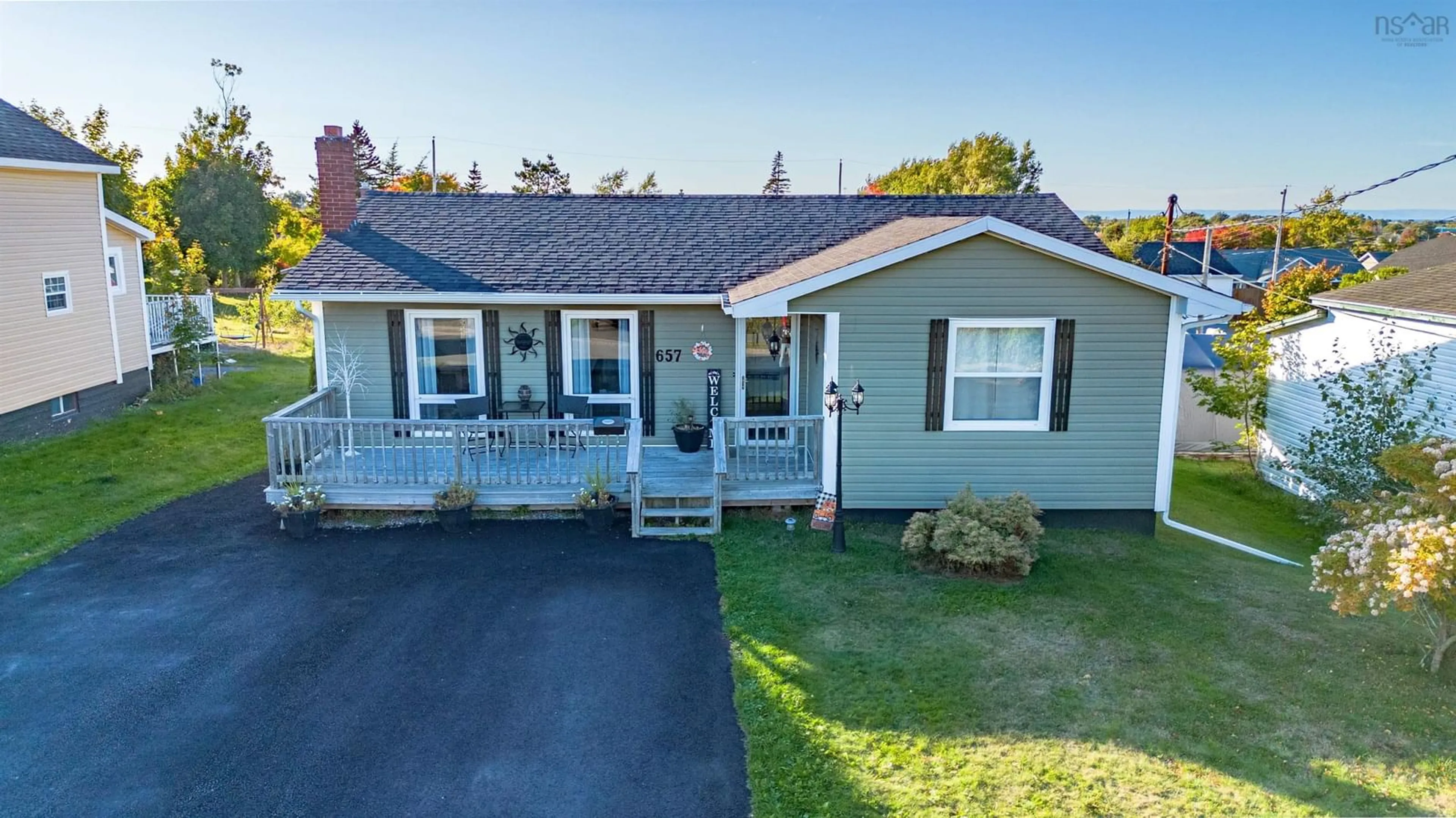Home with vinyl exterior material, street for 657 George St, New Waterford Nova Scotia B1H 4E7