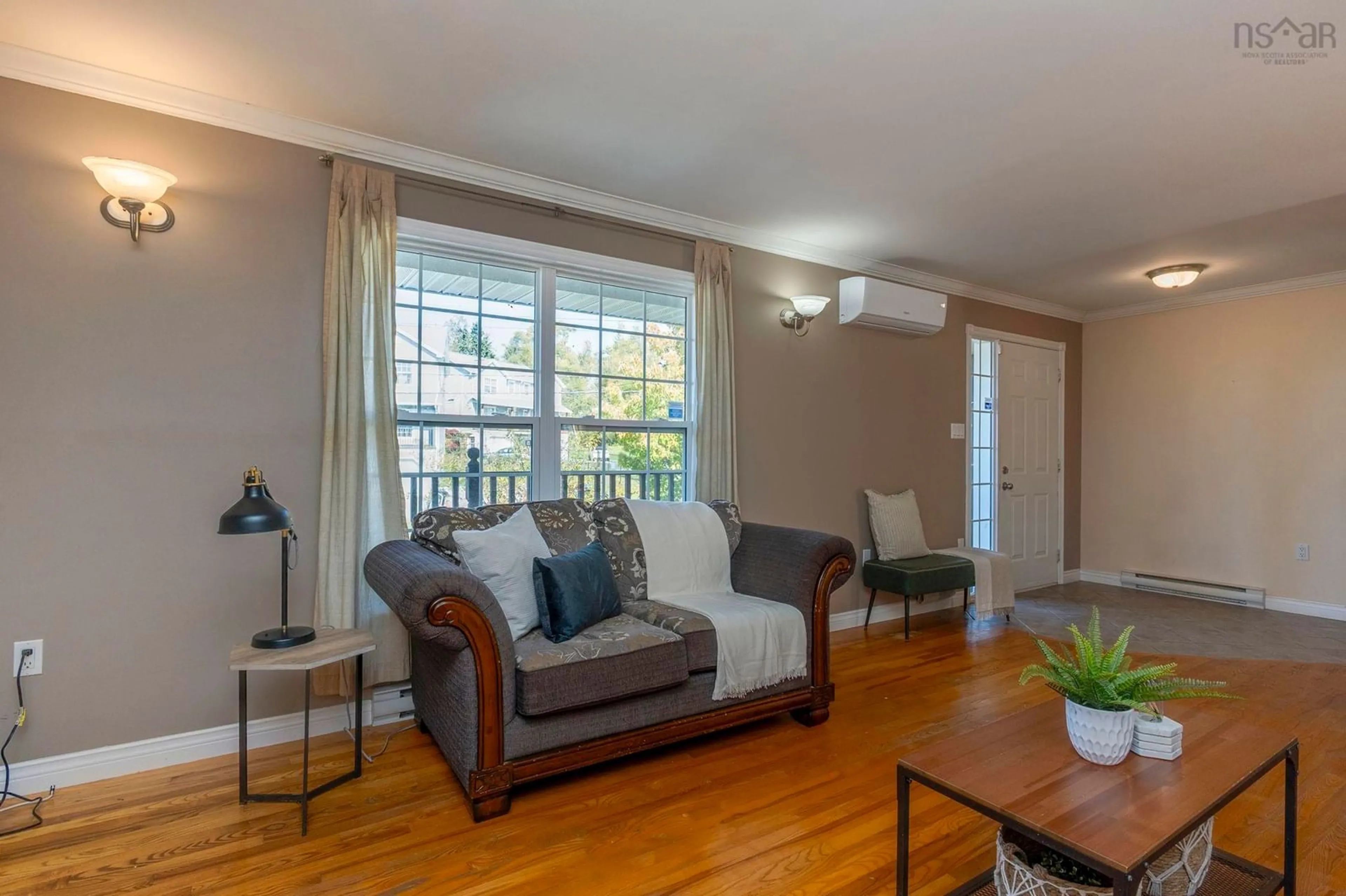 Living room with furniture, wood/laminate floor for 93 Brookview Dr, Dartmouth Nova Scotia B2V 2V6