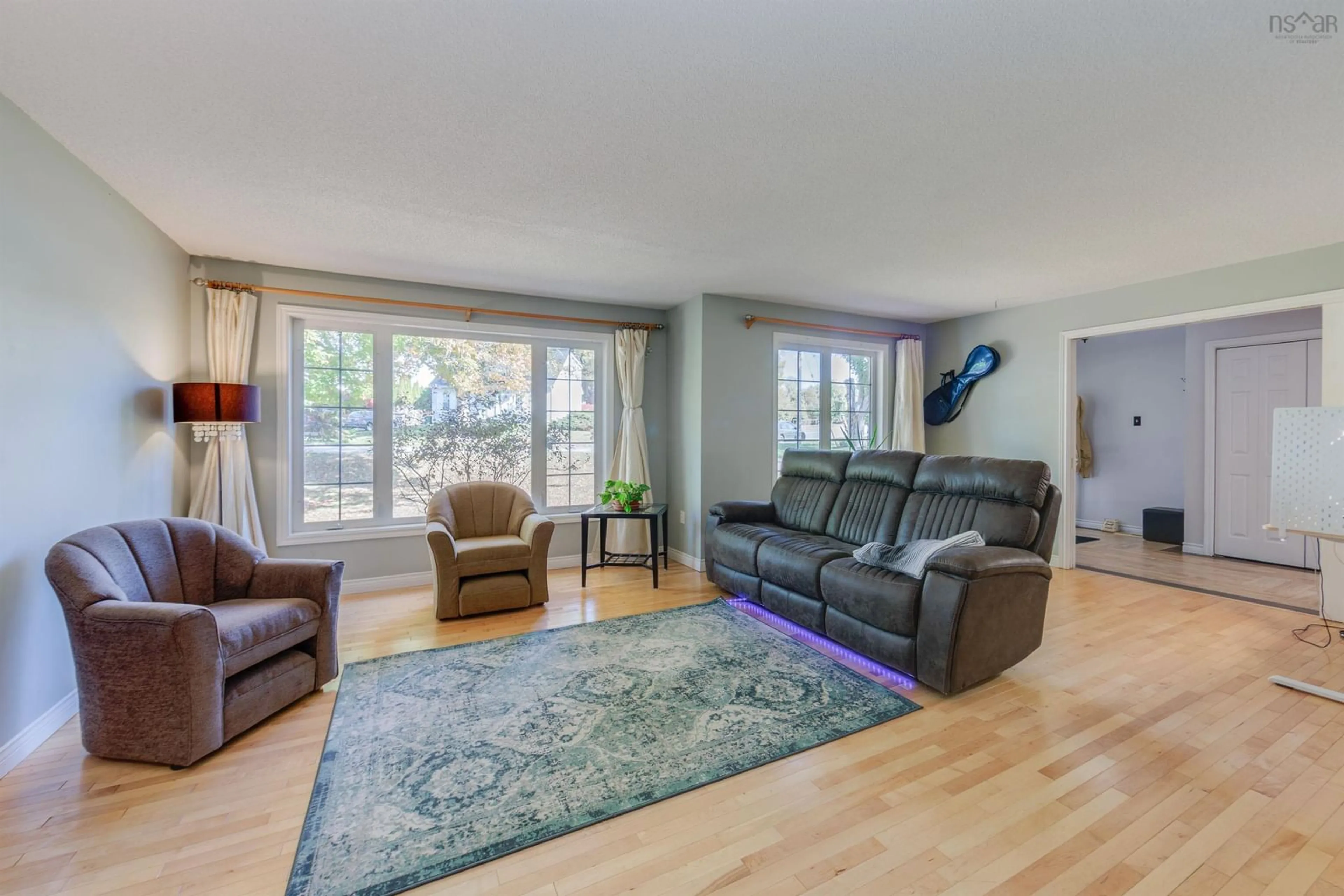 Living room with furniture, wood/laminate floor for 102 Maple Blvd, Bible Hill Nova Scotia B2N 4N3