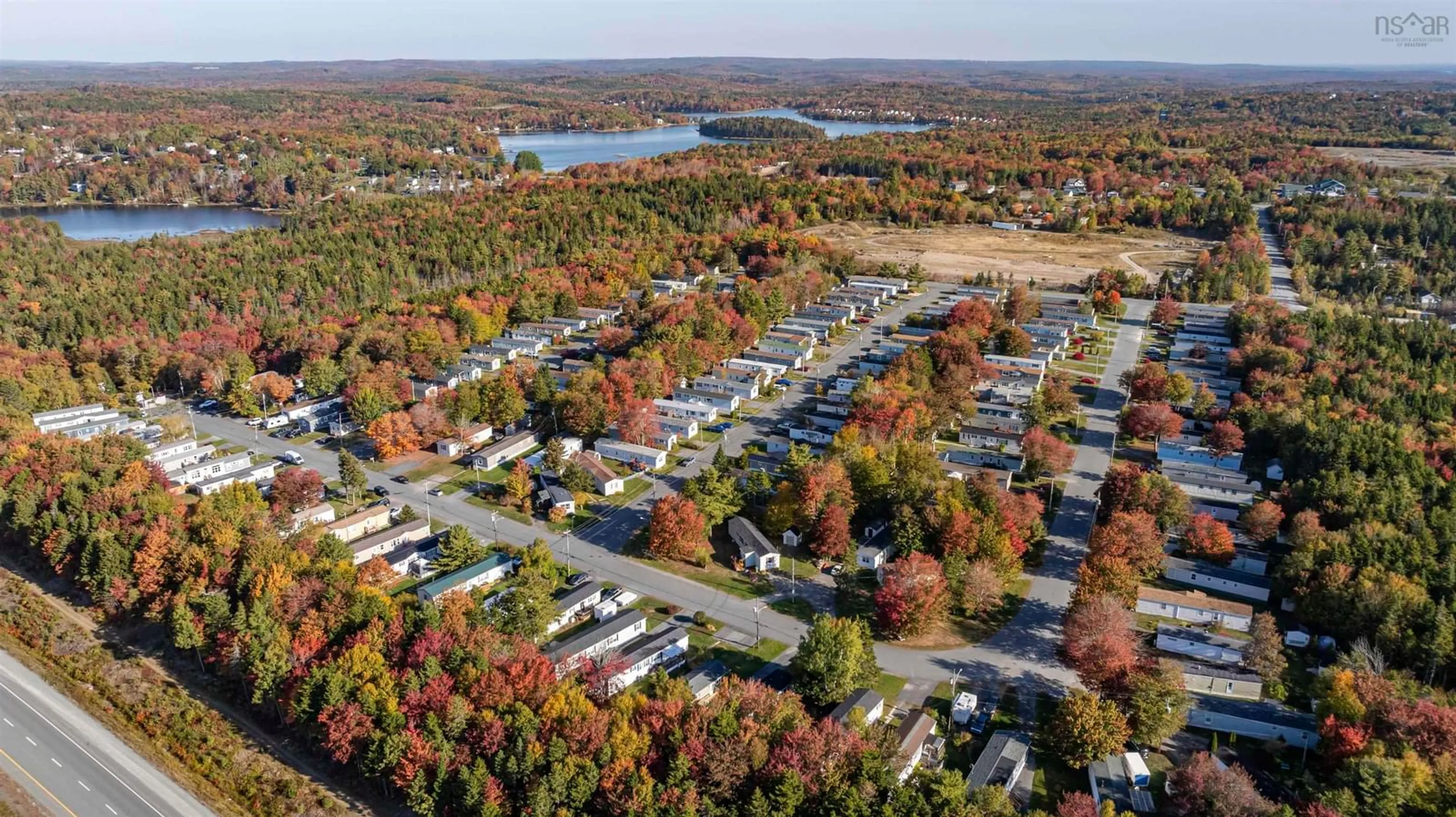 A pic from outside/outdoor area/front of a property/back of a property/a pic from drone, water/lake/river/ocean view for 35 Sylvan Ave, Middle Sackville Nova Scotia B4B 3B2