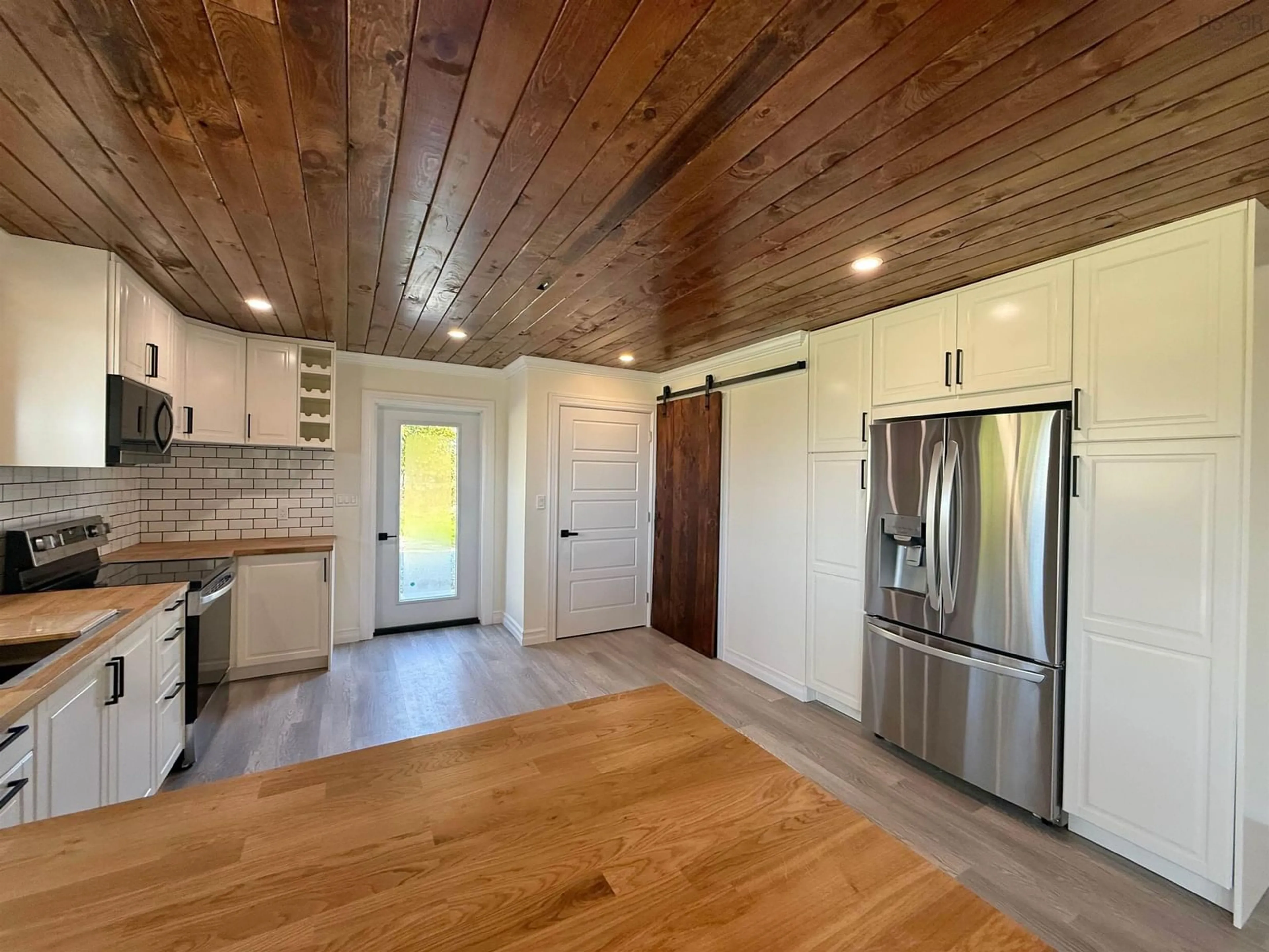 Open concept kitchen, wood/laminate floor for 1280 1 Hwy, Wellington Nova Scotia B5A 5A5